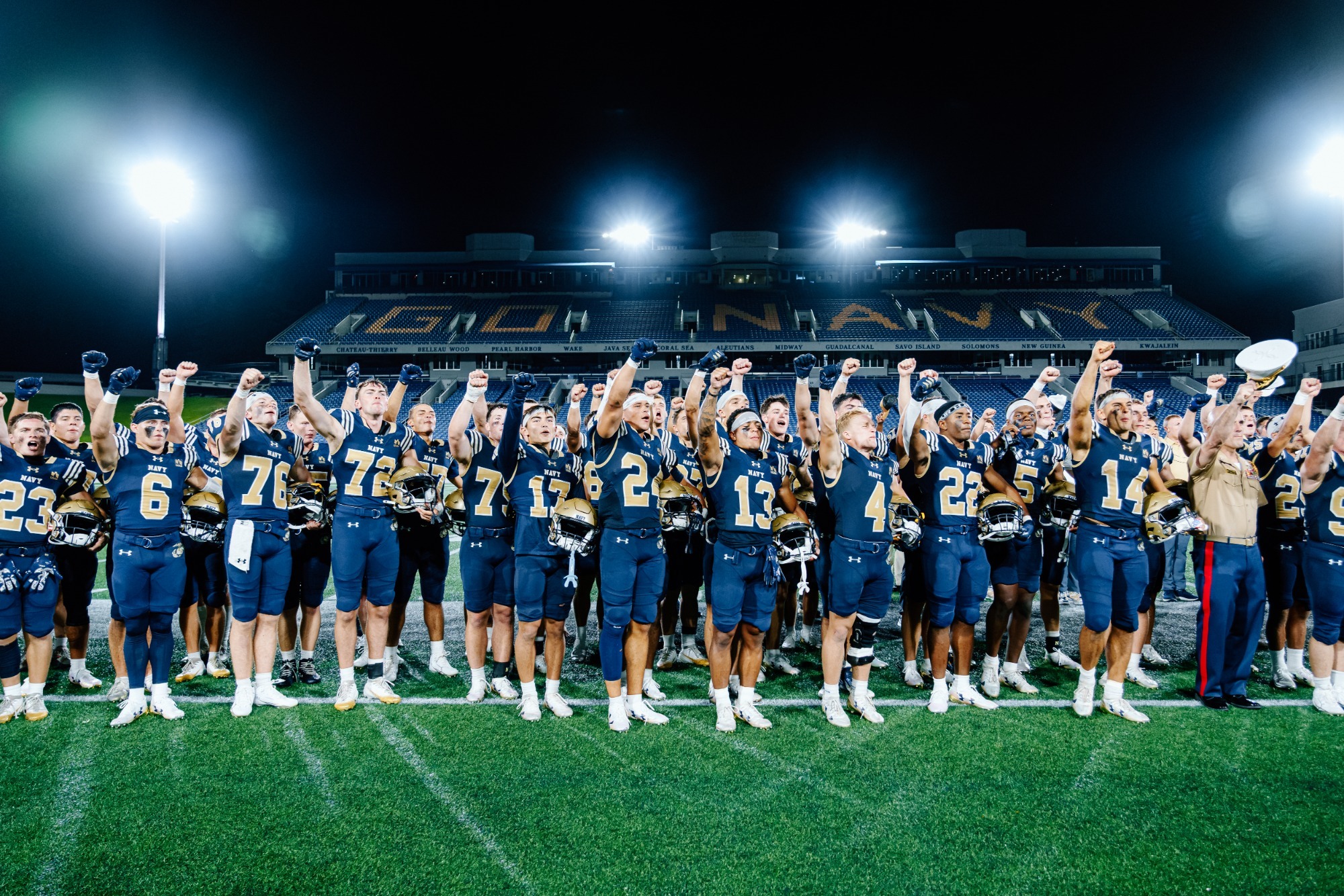 Sprint Football team celebrates their win over Penn after singing Navy Blue & Gold