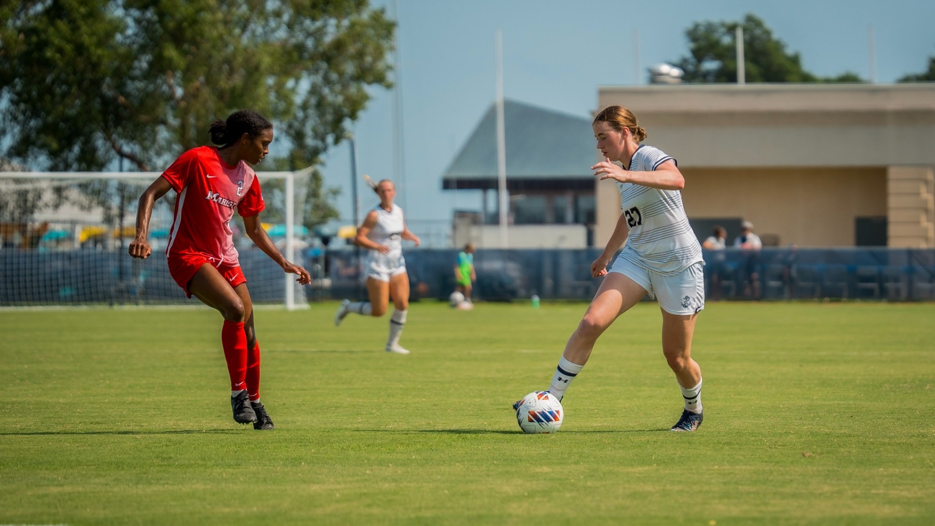 Sofia Grundy dribbles past a Marist defender