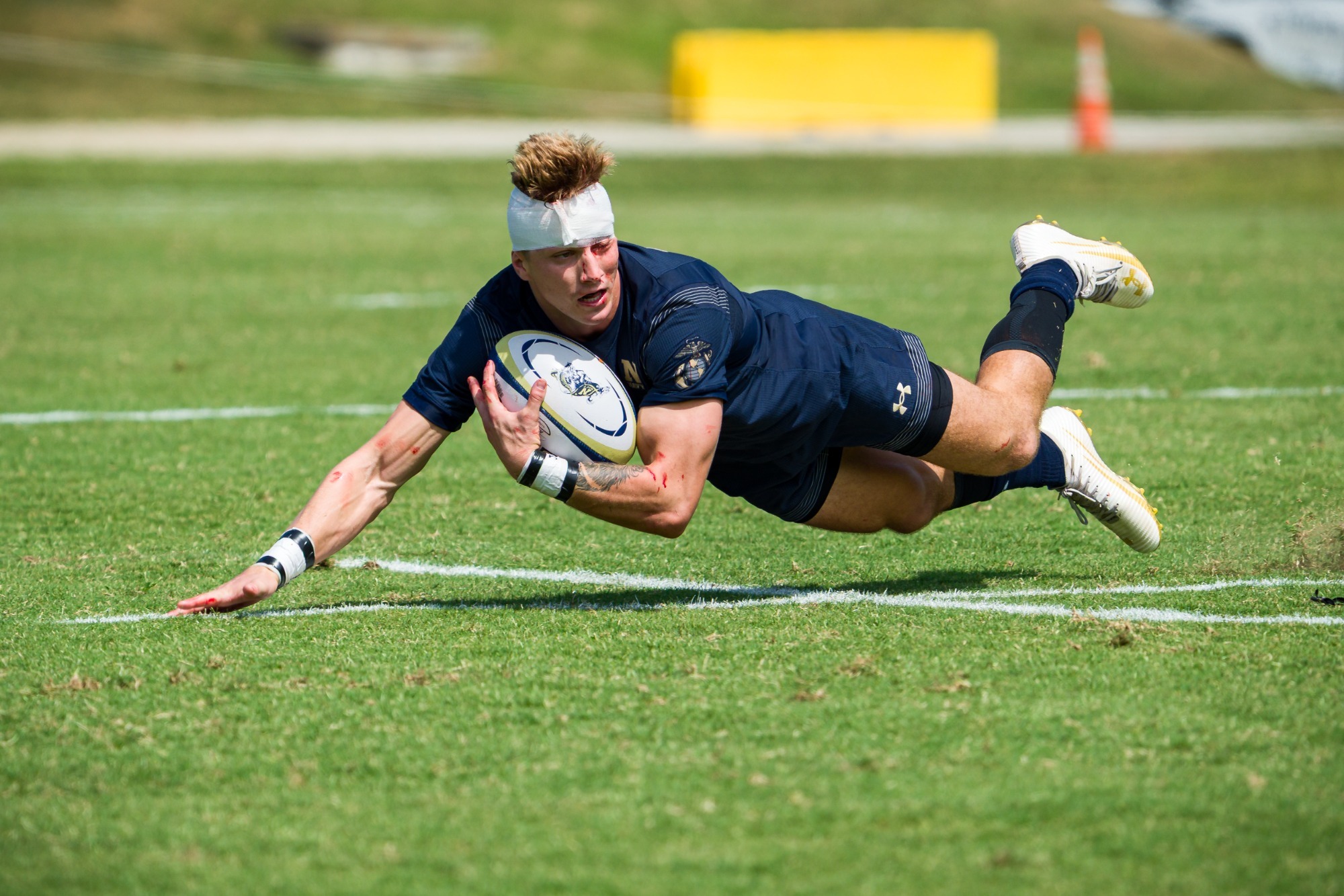 Andrew Baublitz dives for a loose ball in Navy's win over Army