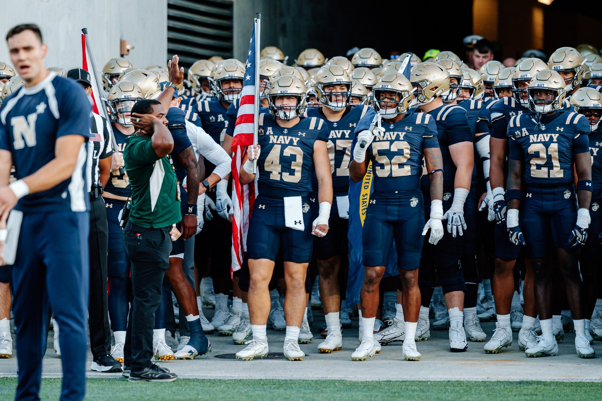 The Navy Football team gets ready to take the field 