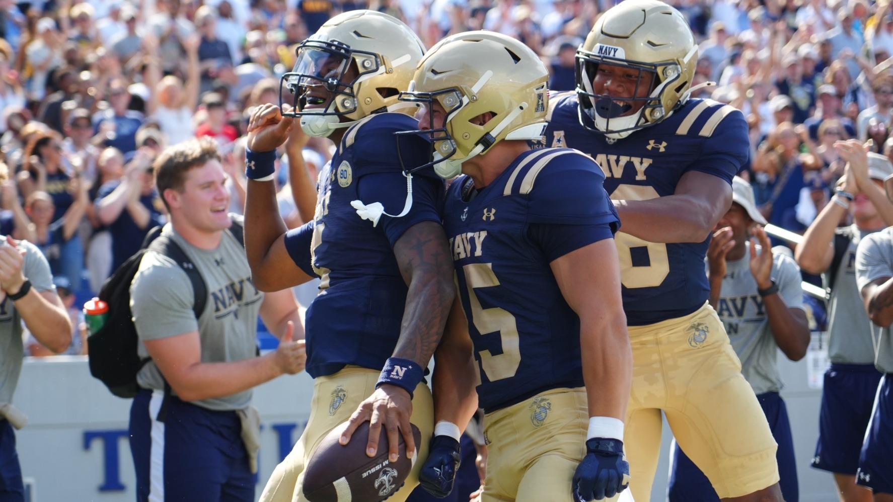Navy senior quarterback Braxton Woodson celebrates his touchdown with teammates vs. Towson on September 5, 2026 at Navy-Marine Corps Memorial Stadium in Annapolis, Md.