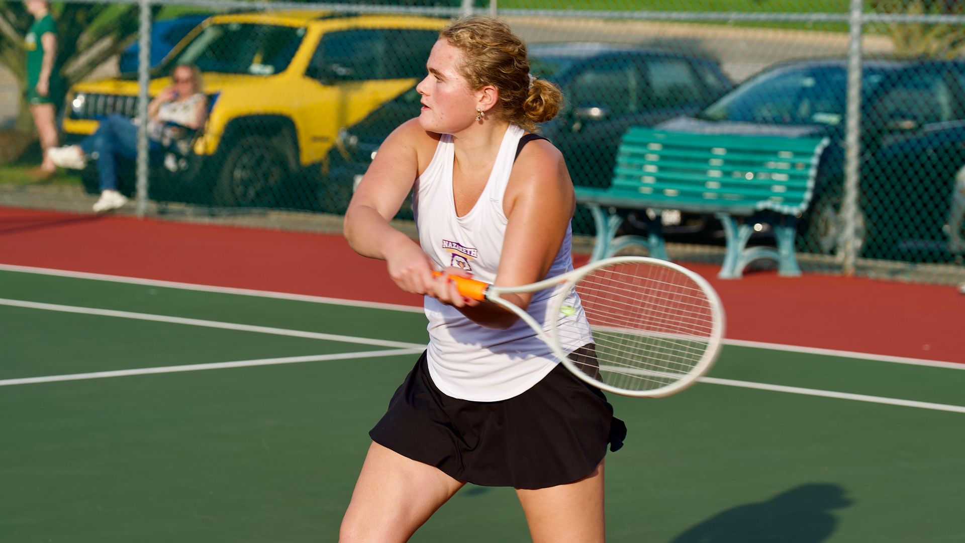 Lily Brady hitting backhand vs Brockport