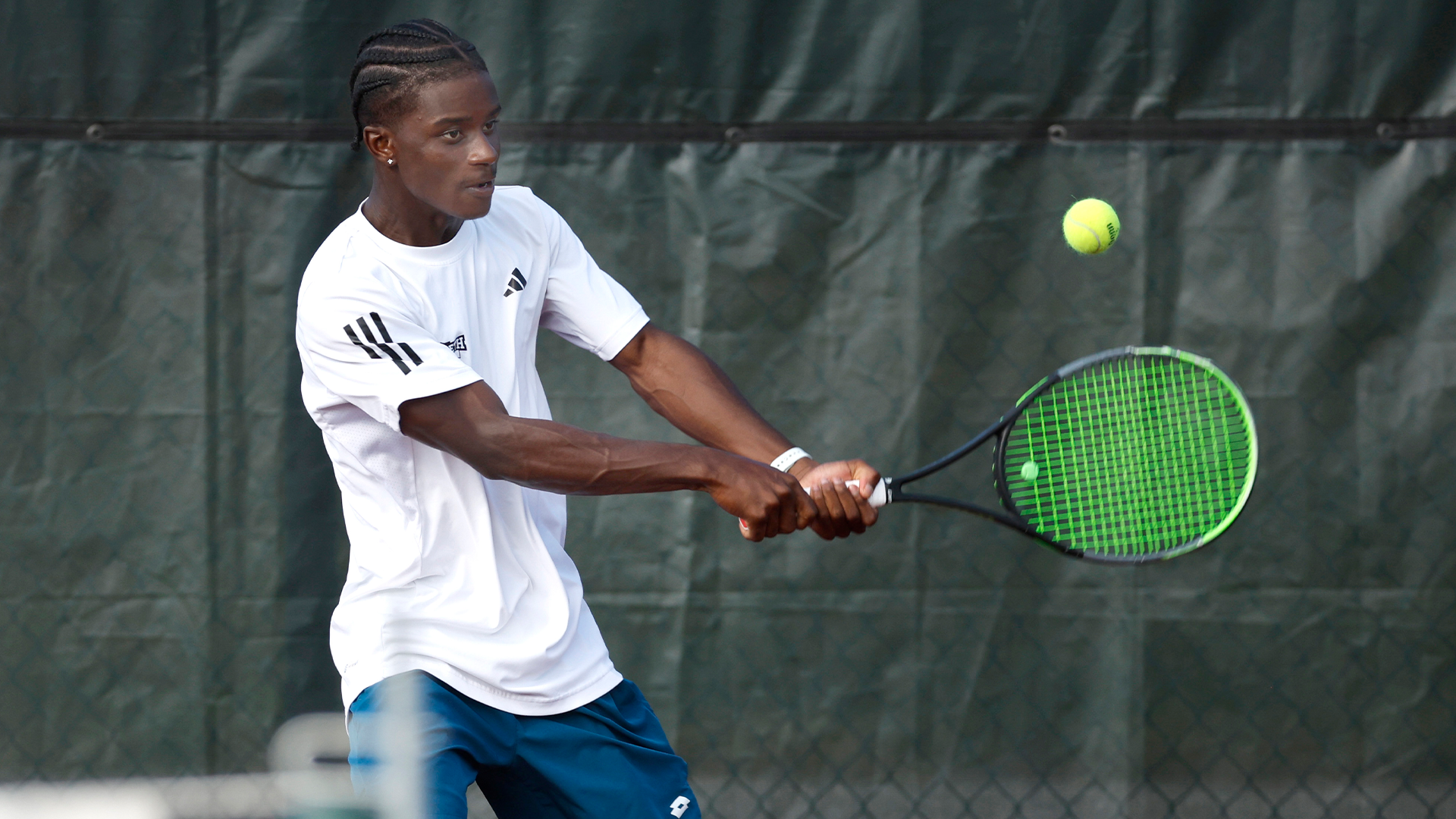 Ntonga hitting a backhand