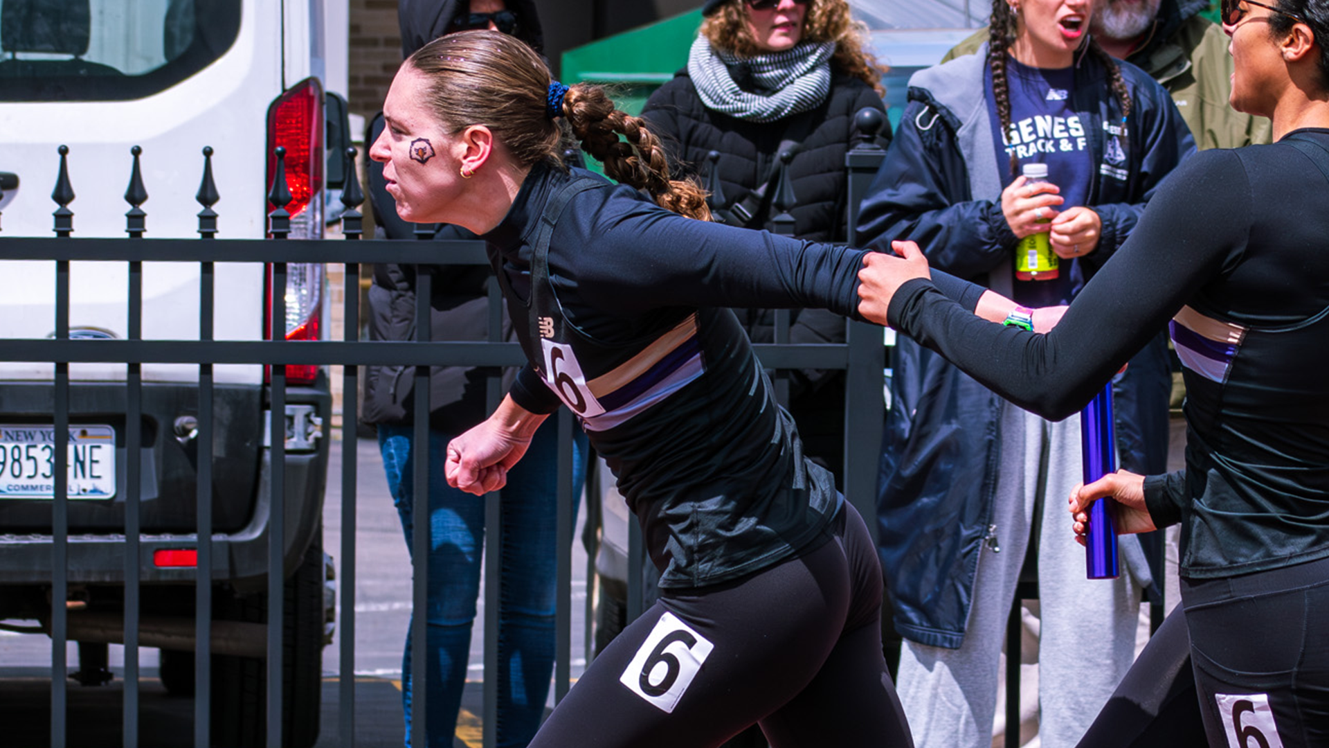 Samantha Luba running relay at E8 outdoor championships