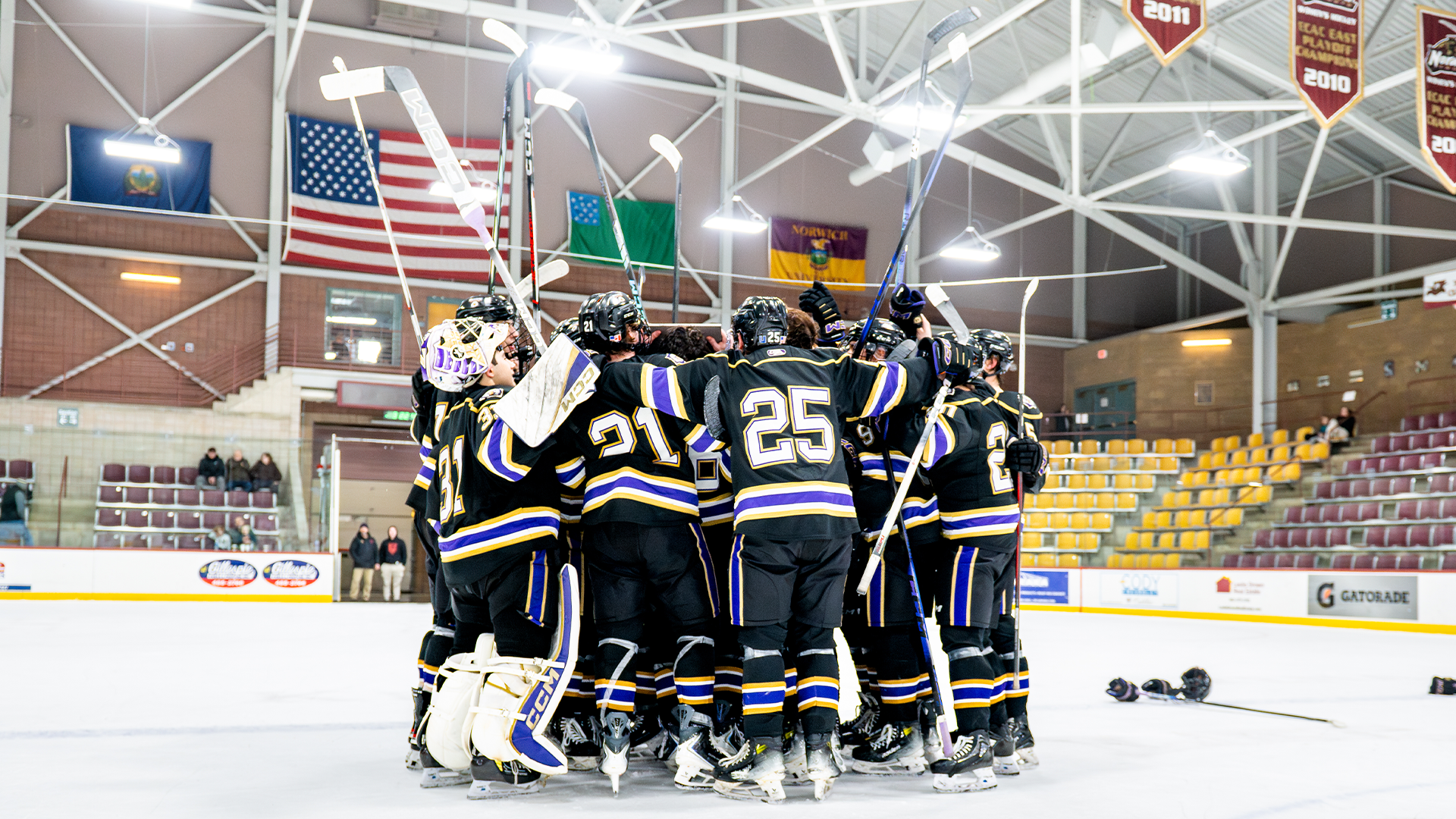 Men's Hockey team huddle at Norwich Tournament 