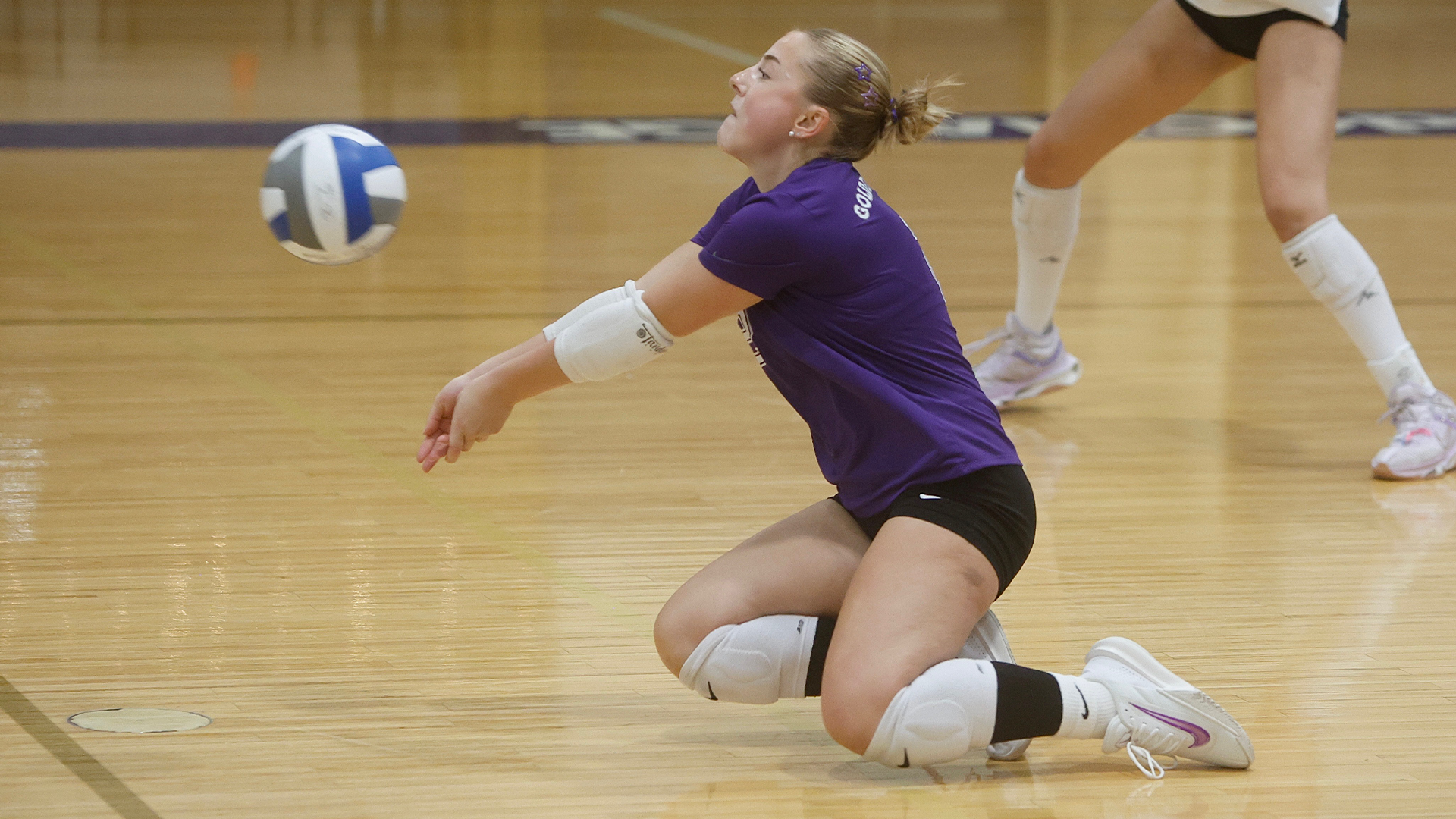 Gretchen Klossner digging vs. Rochester