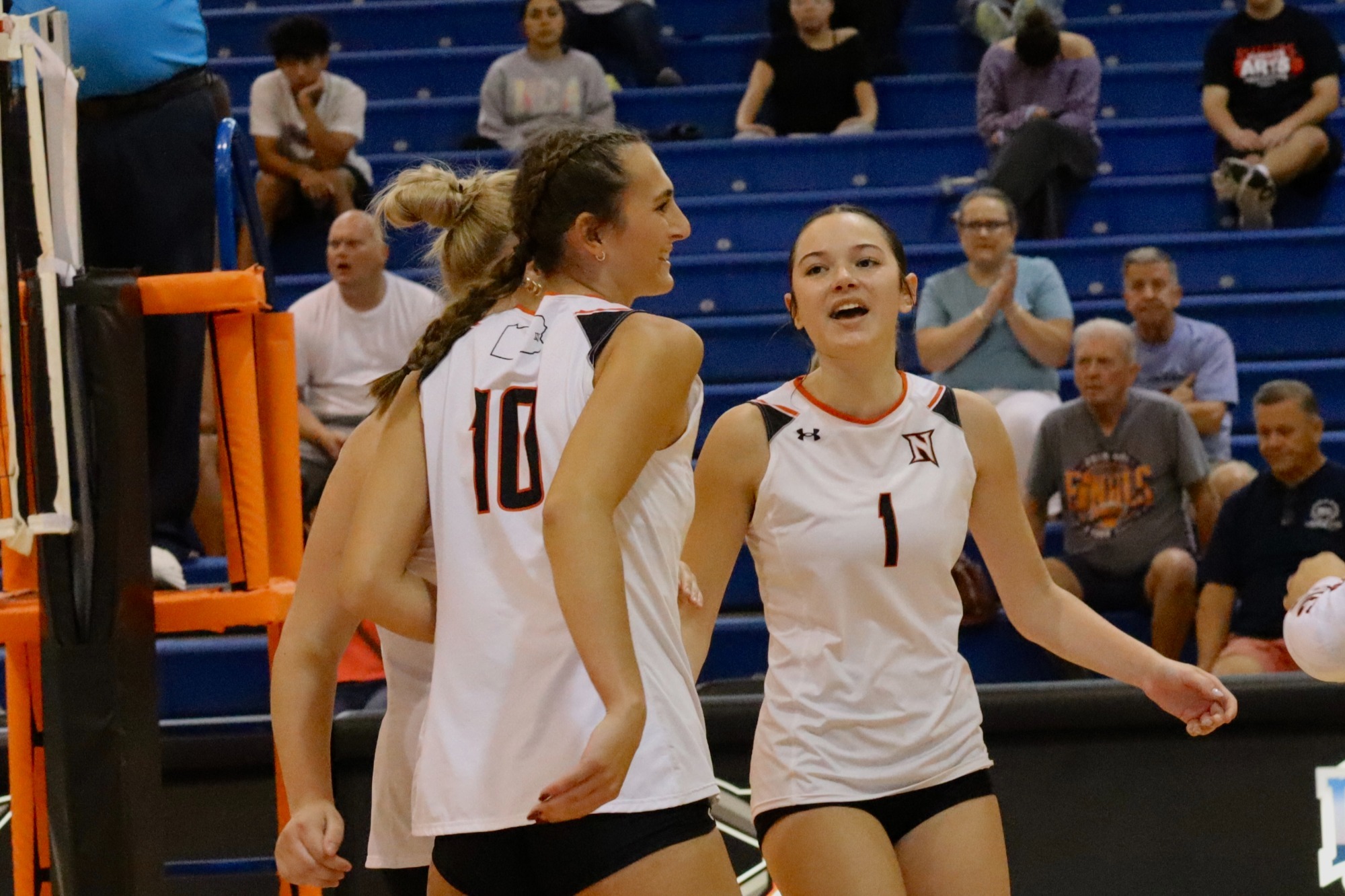 Kyra Miller and Allie Keck celebrate after a point