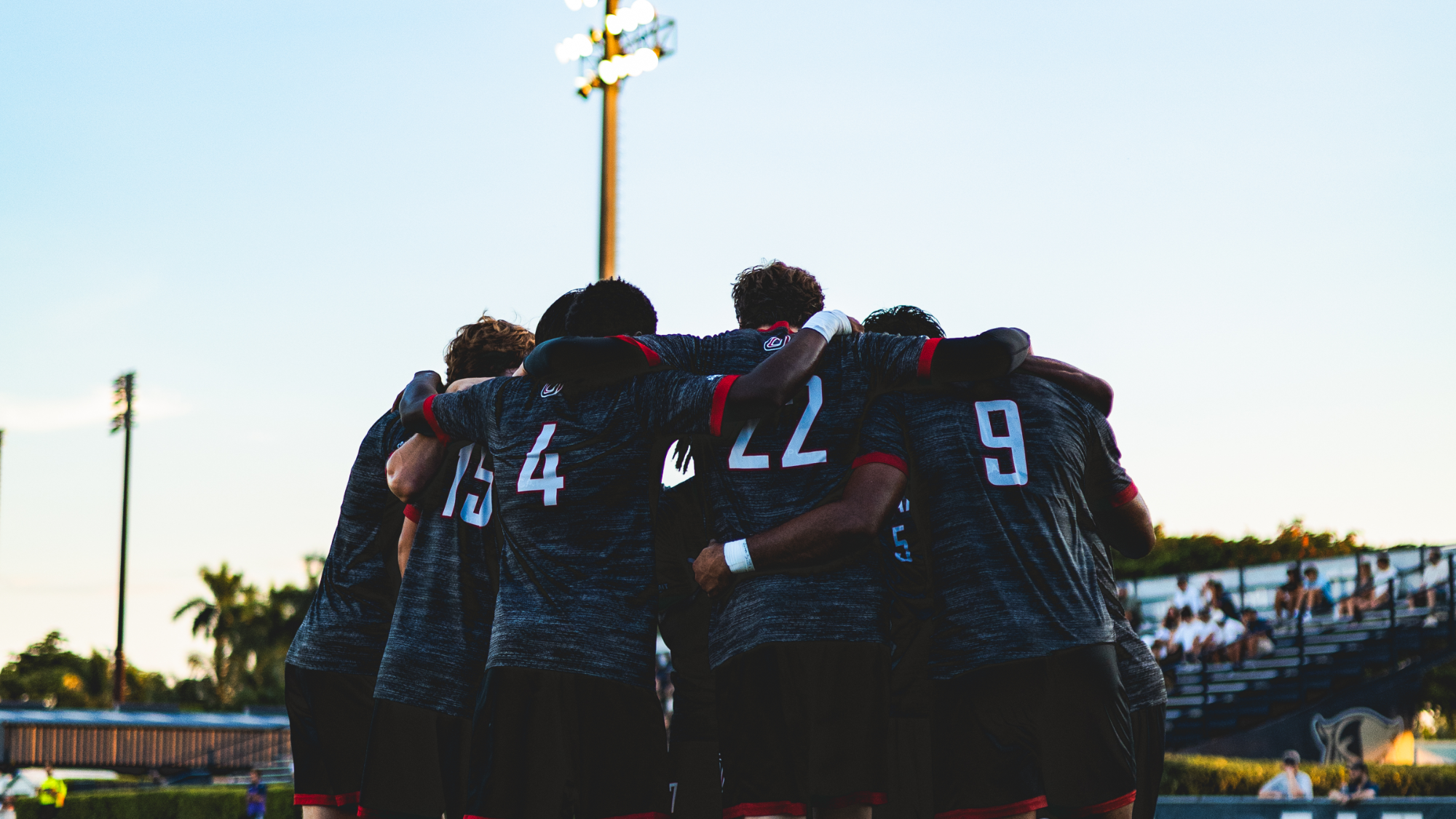 Omaha men's soccer huddles before the match at FIU
