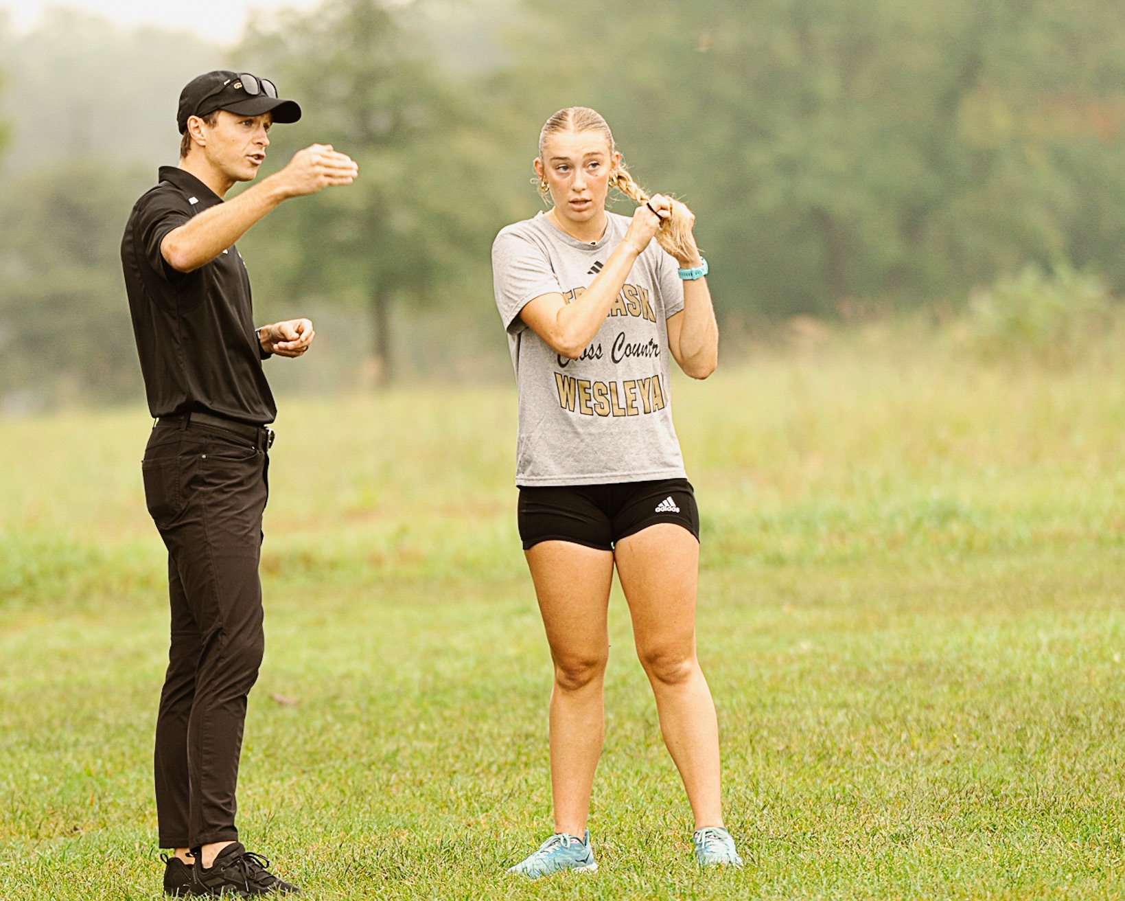 Coach Berens and Ella Herzberg discuss race strategy