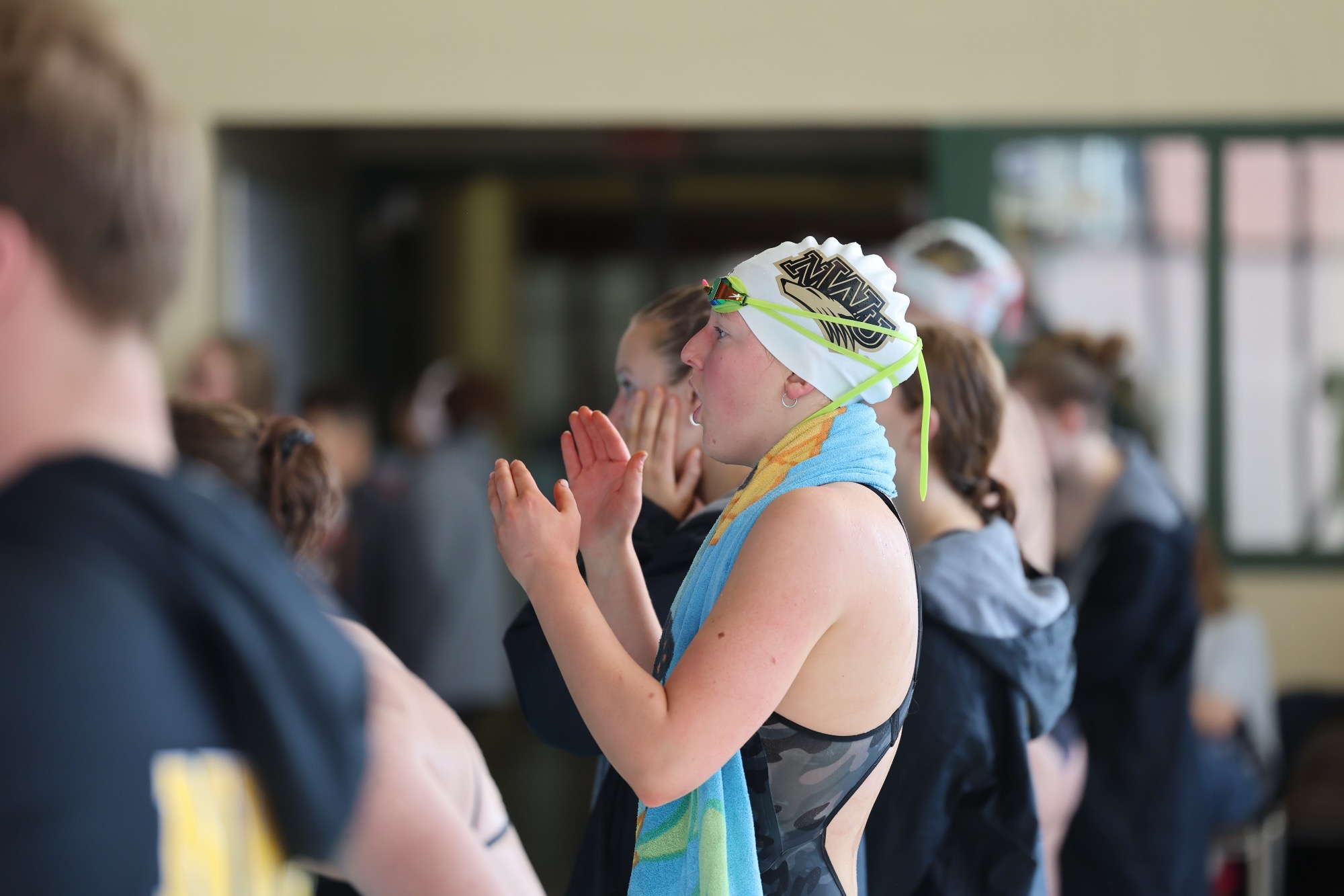 Sydney Leslie cheers on her teammates