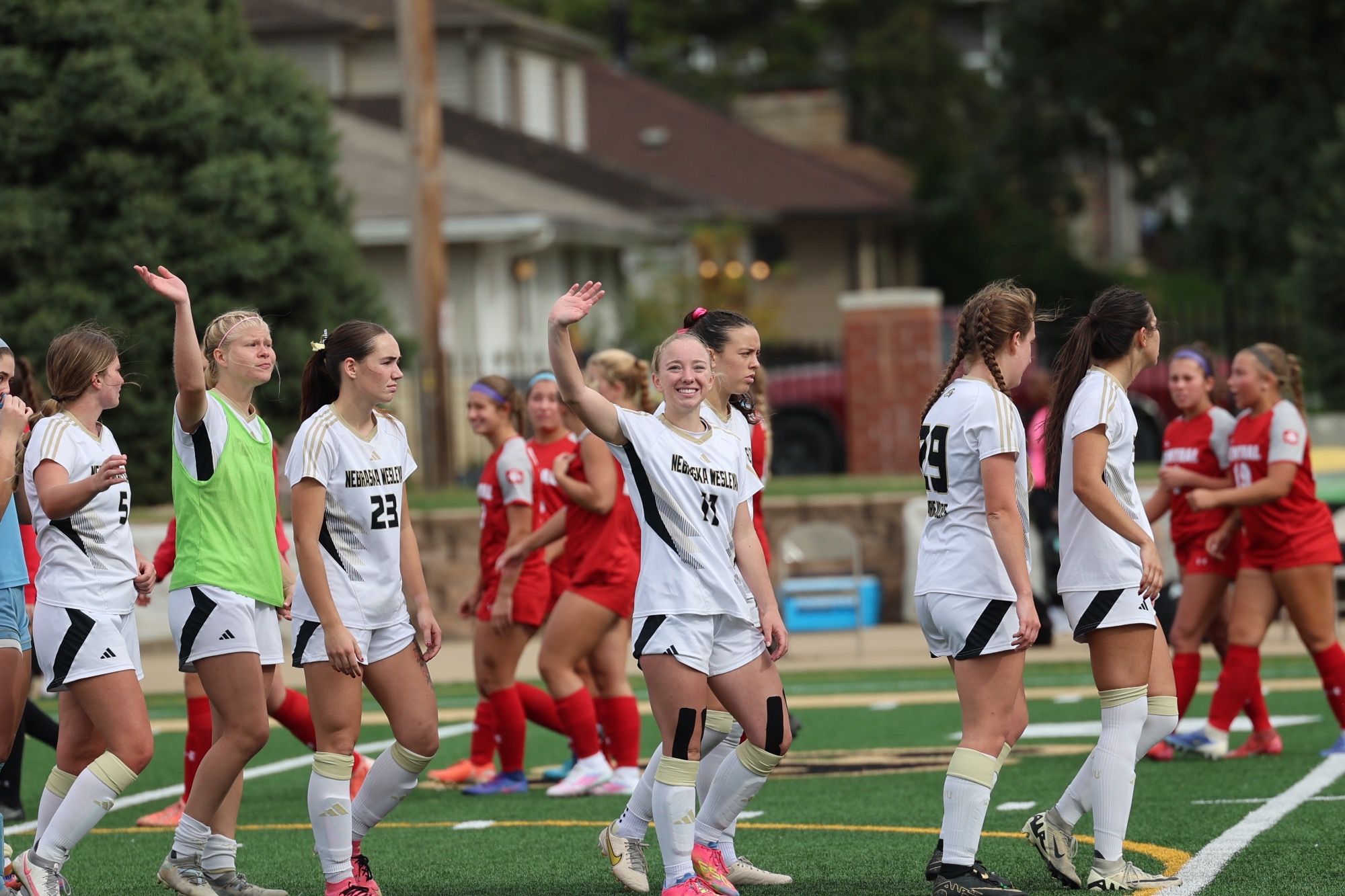 Ava Reed waves to the home crowd
