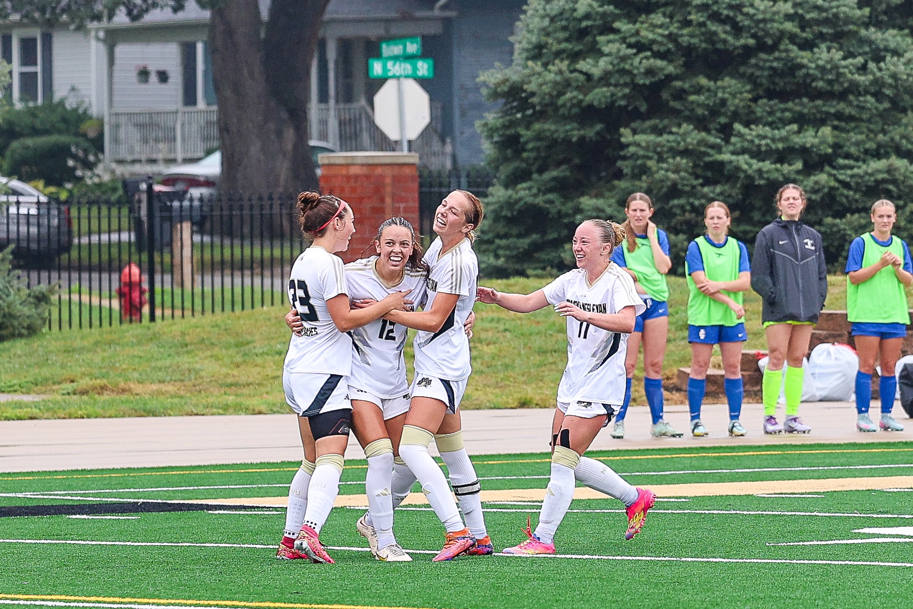 Emily Abeyta celebrates a score with her teammates