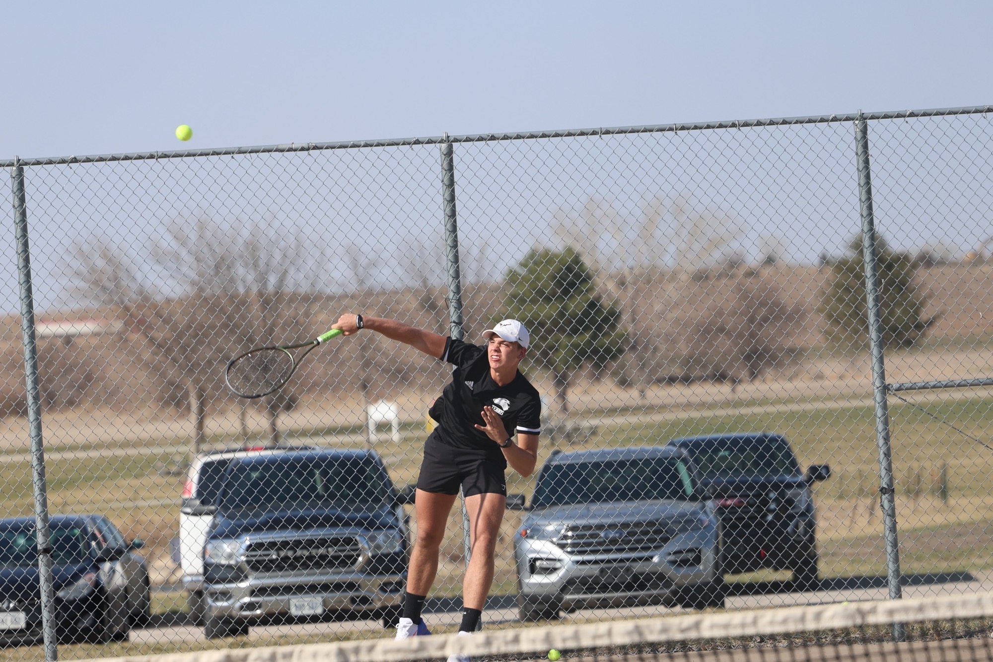 Gavin Nichols delivers a strong serve