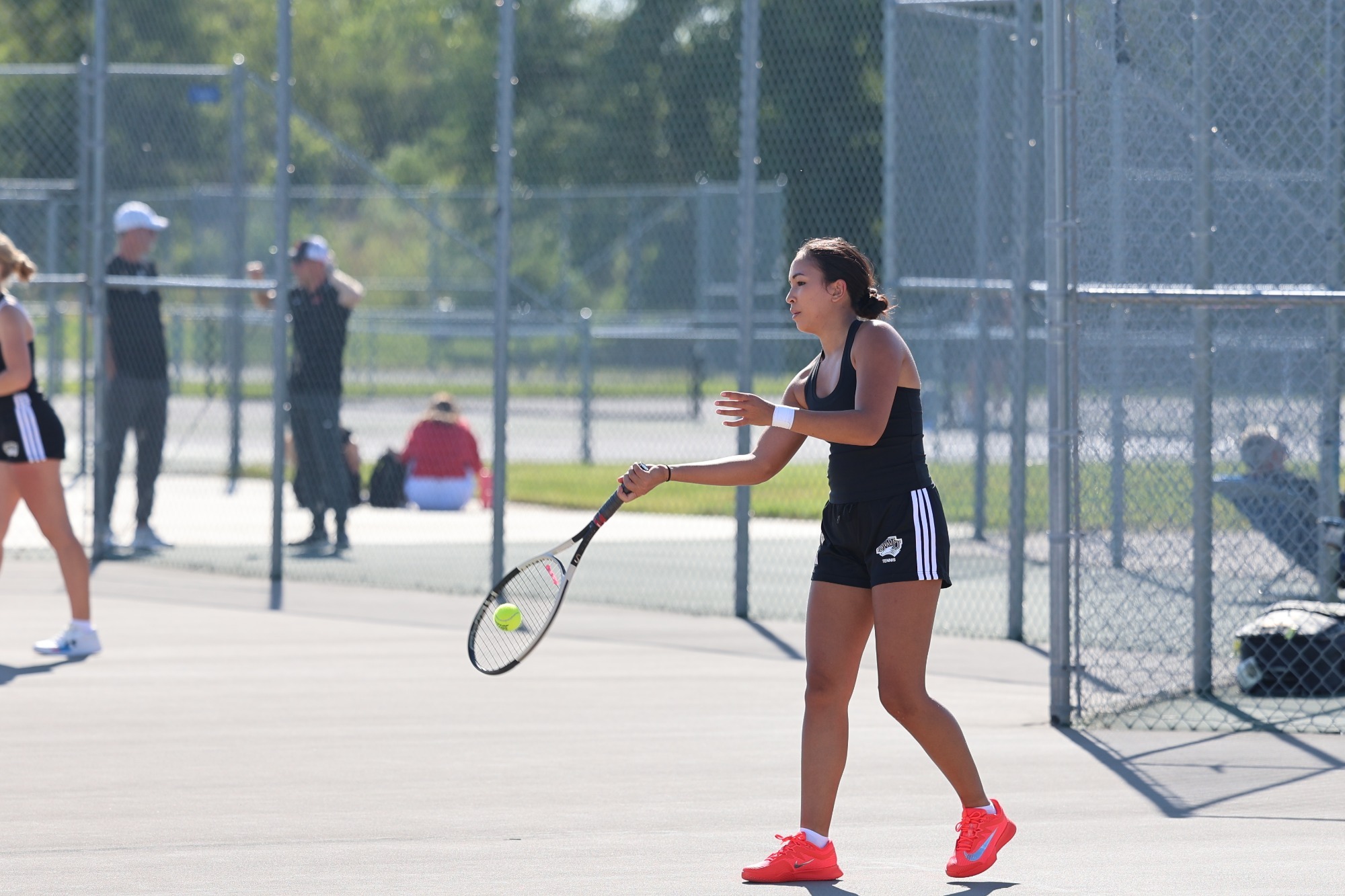 Crystal Craft returns the ball against wartburg
