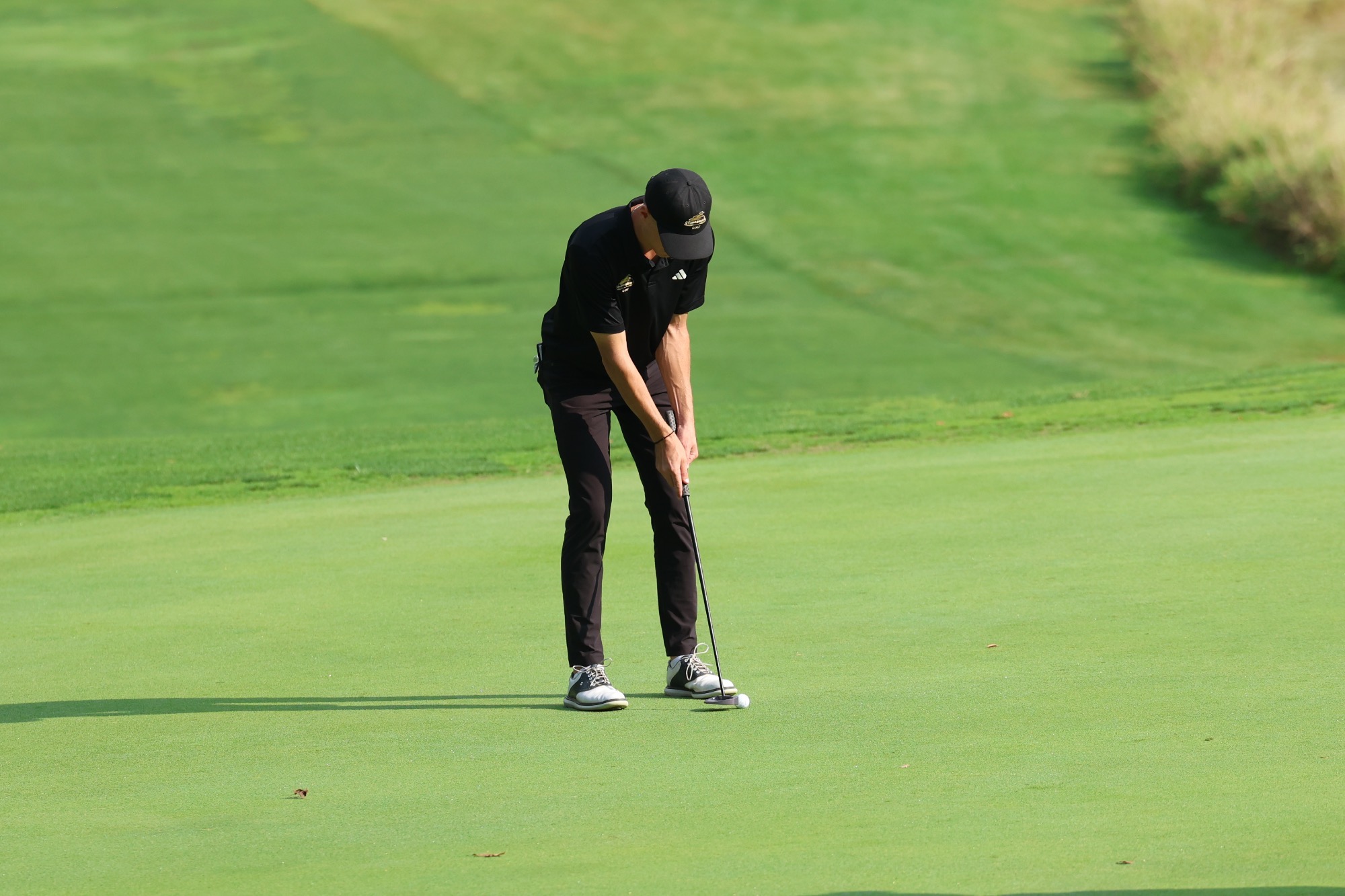 Brayden Schram putts to win the Nebraska Intercollegiate