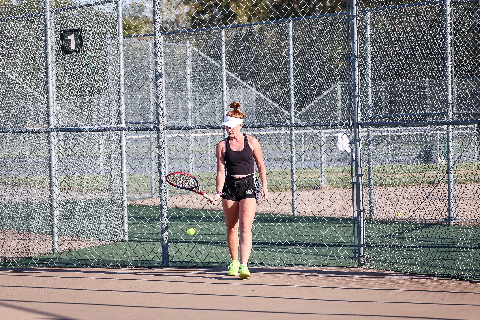 Sylvia Kamradt bounces the ball to herself in preparation for serve