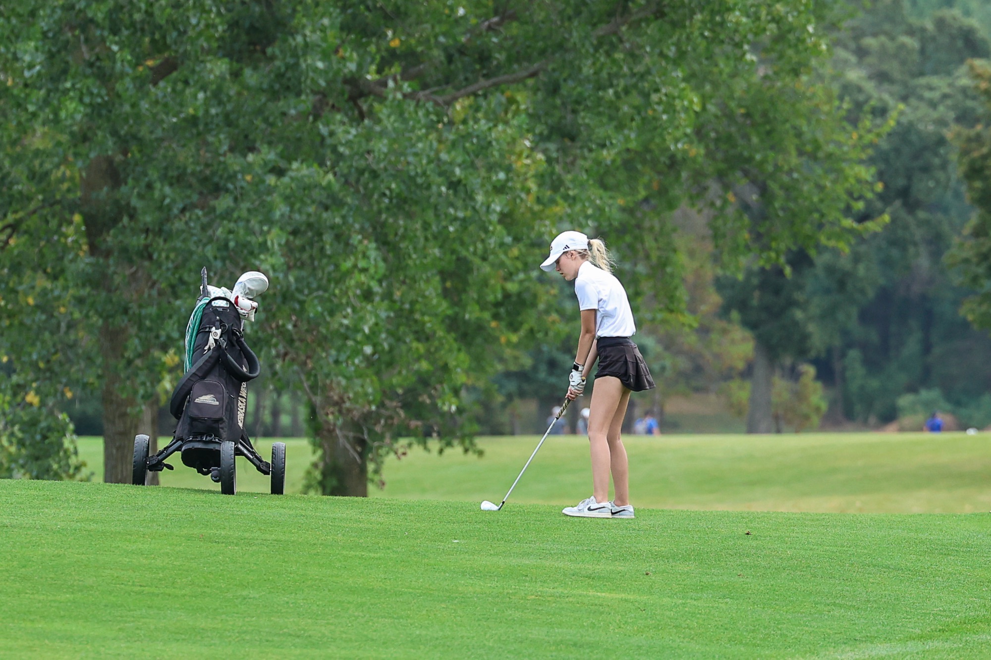 Shea Meridith lines up in the fairway for an approach shot