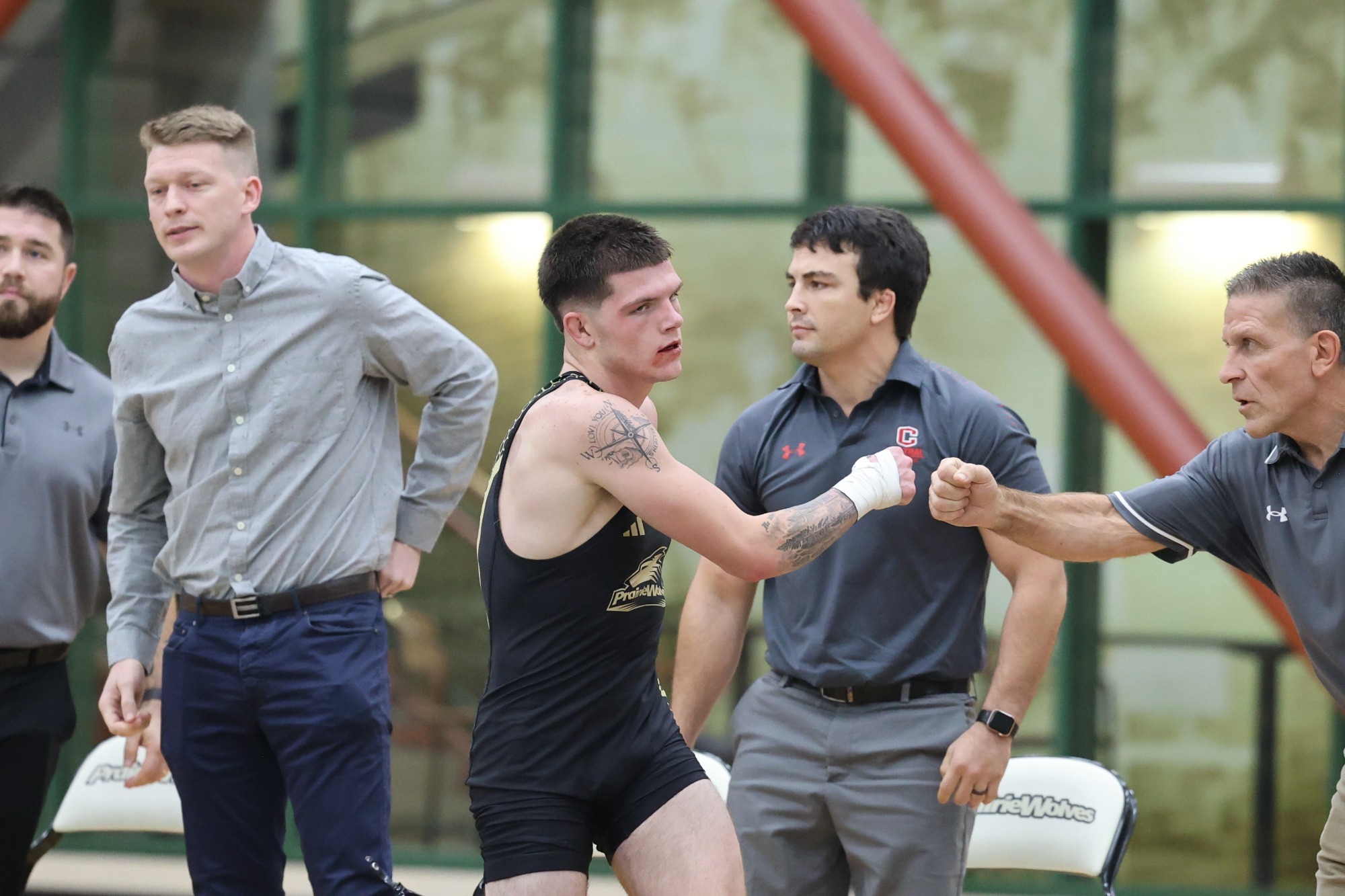 Robbie Fisher fist bumps Central's head coach after a match