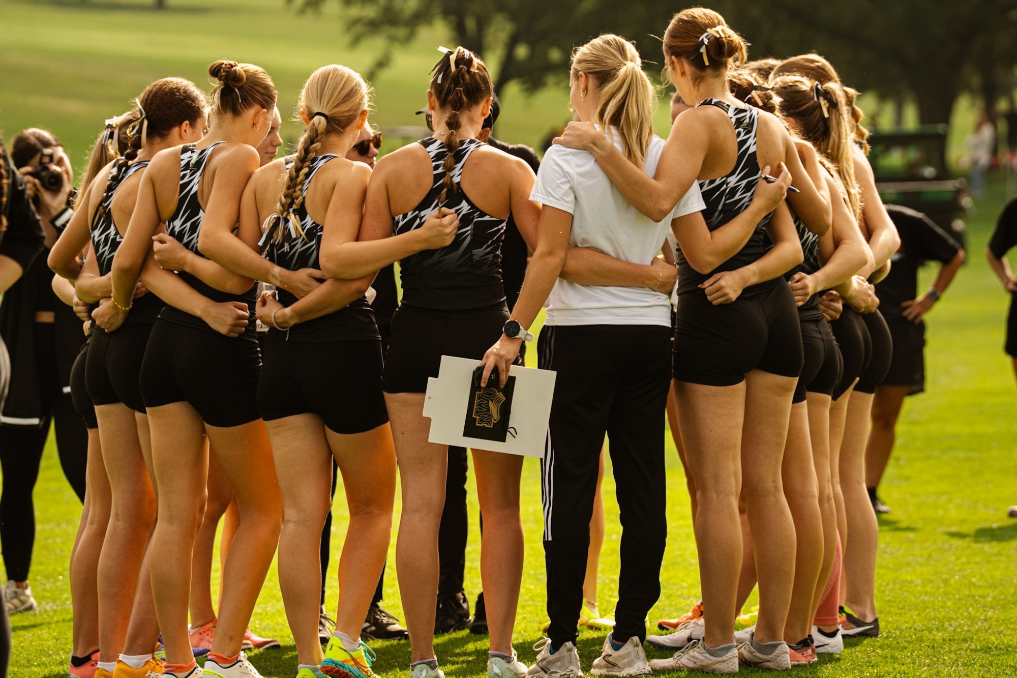 women's cross country team talks before beginning the race