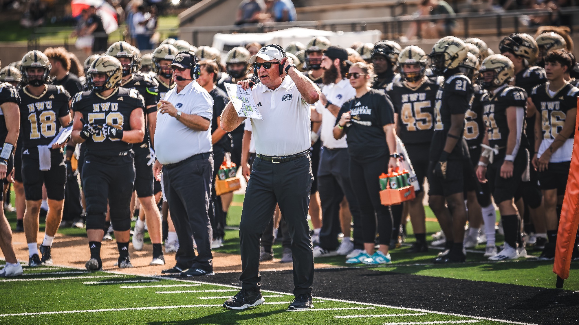 Brian Keller steps onto the field to give direction to his team.