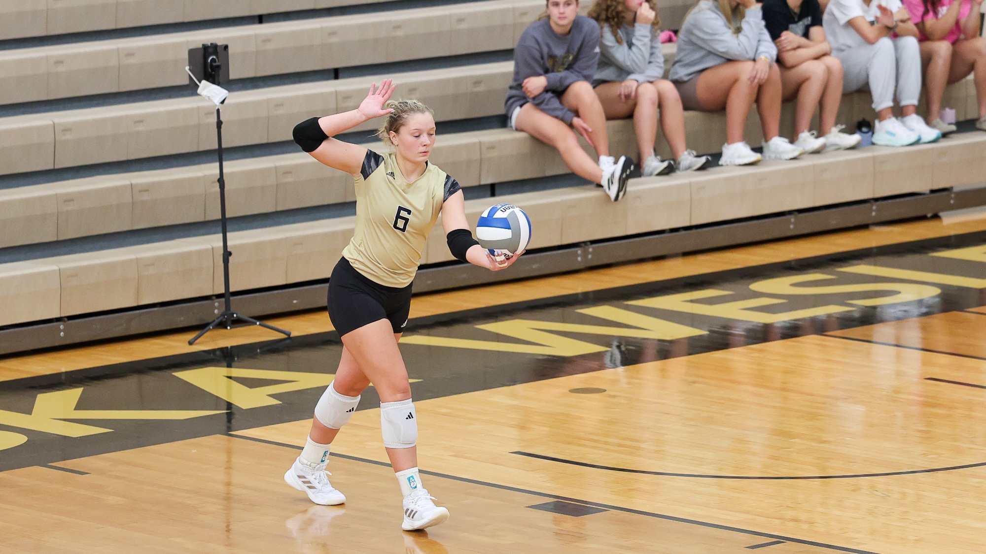 Elecea Saathoff lines up to serve