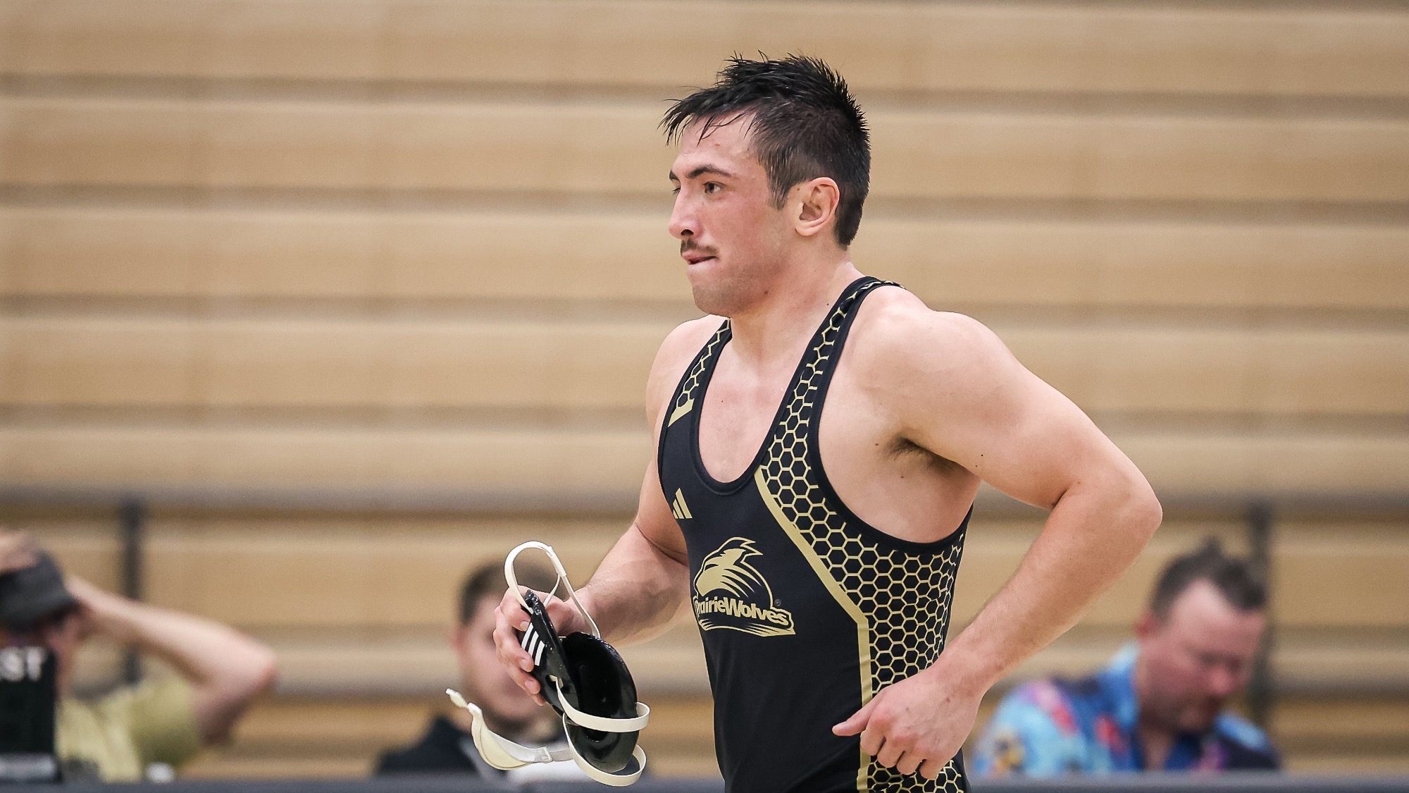 Cy Peterson jogs off the mat