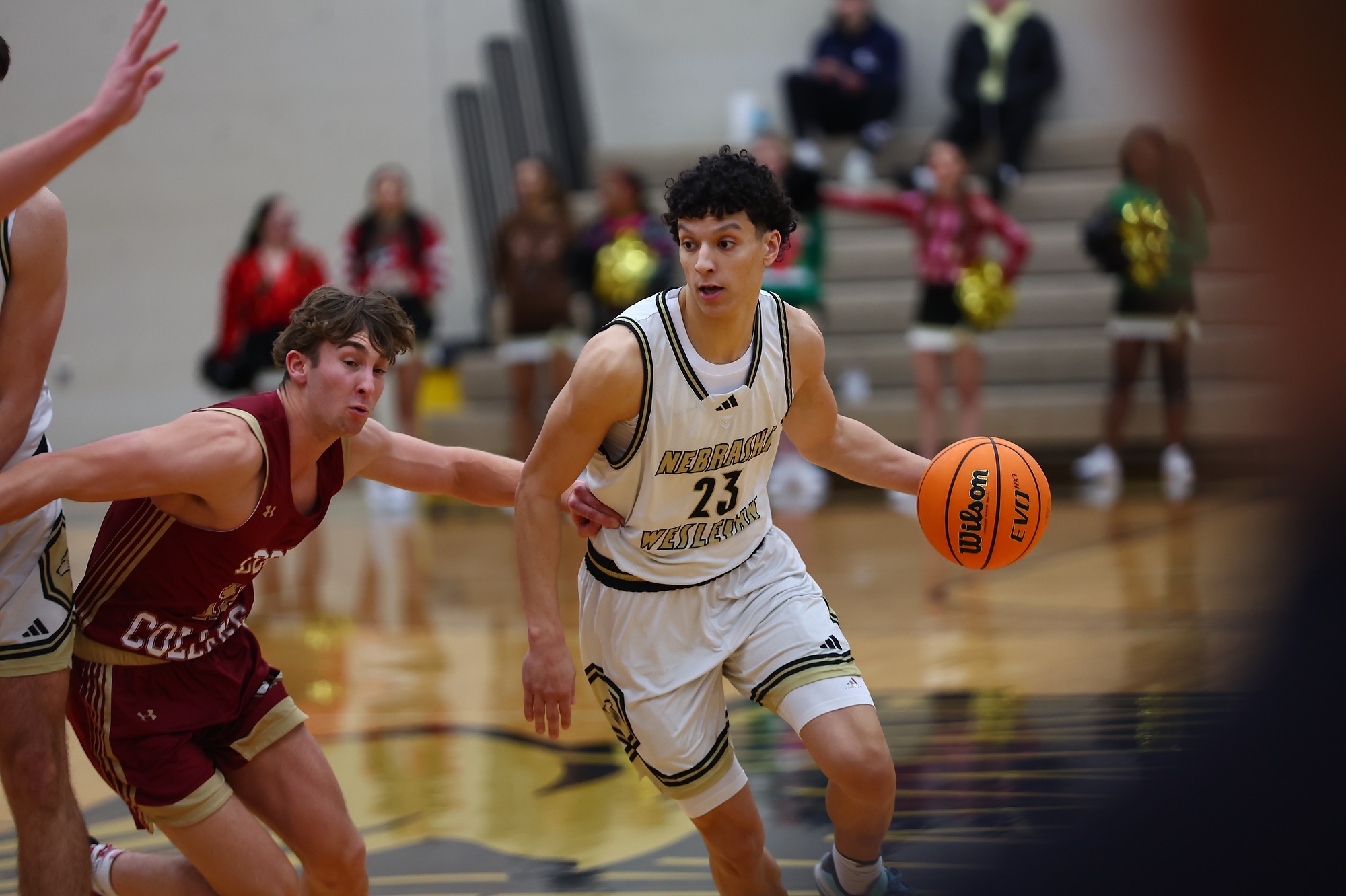 Christian Winn drives down the lane against Coe