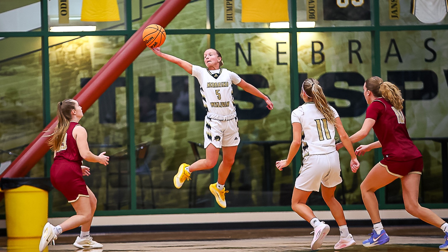 Peyton Tritz flies through the air to steal a pass.