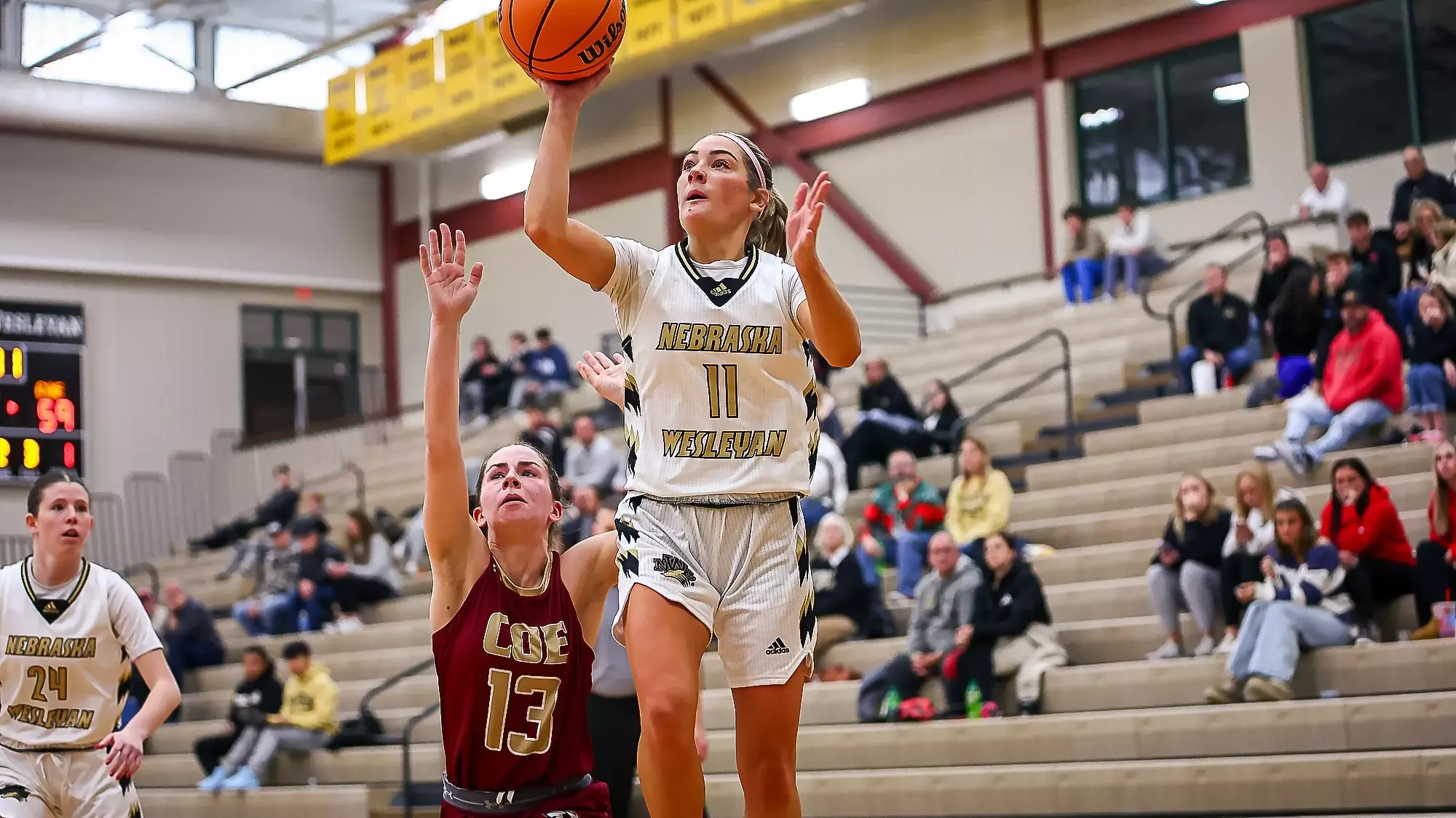 Anastyn Pettlon shoots a floater over the top of a Coe defender