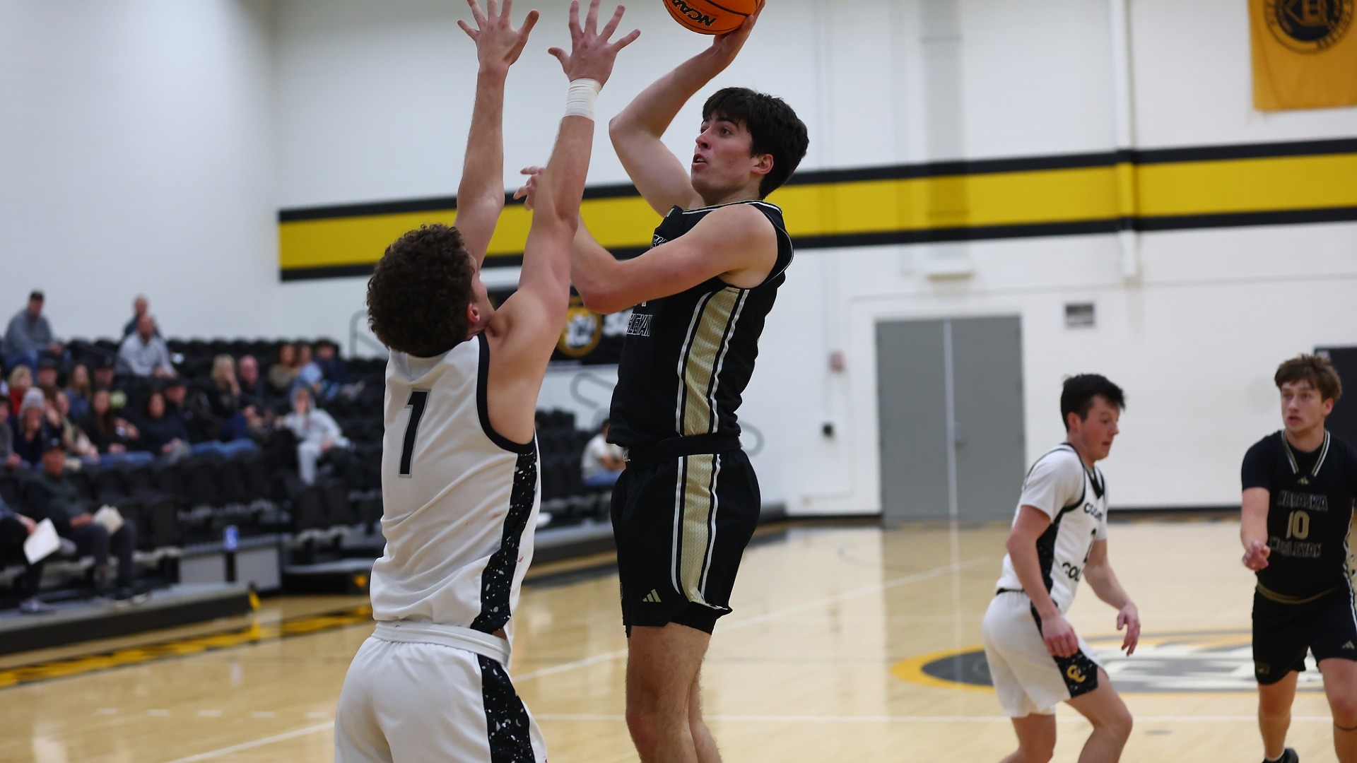 Nick Howard shoots a hook shot over his defender