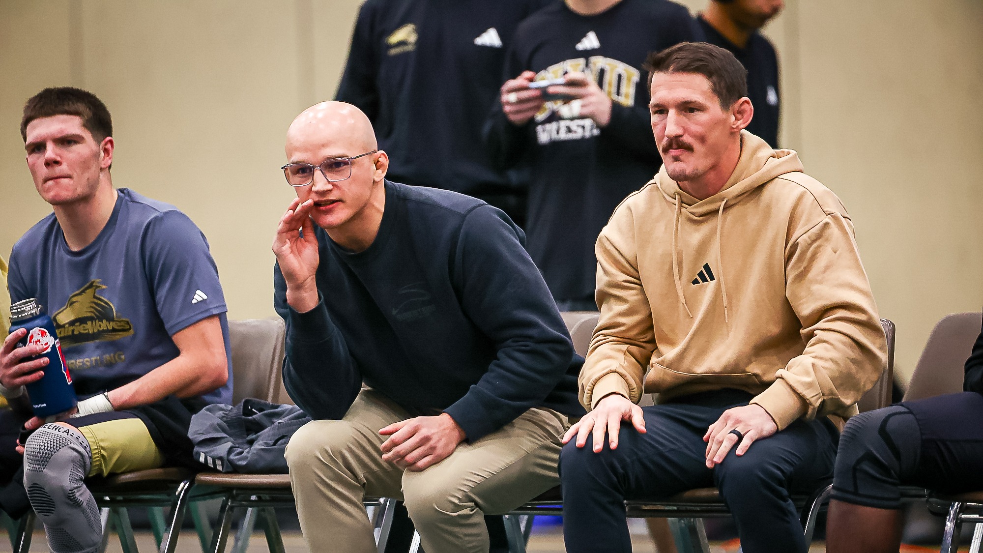 Coach Robb and Coach McCrystal shout instructions from the side.