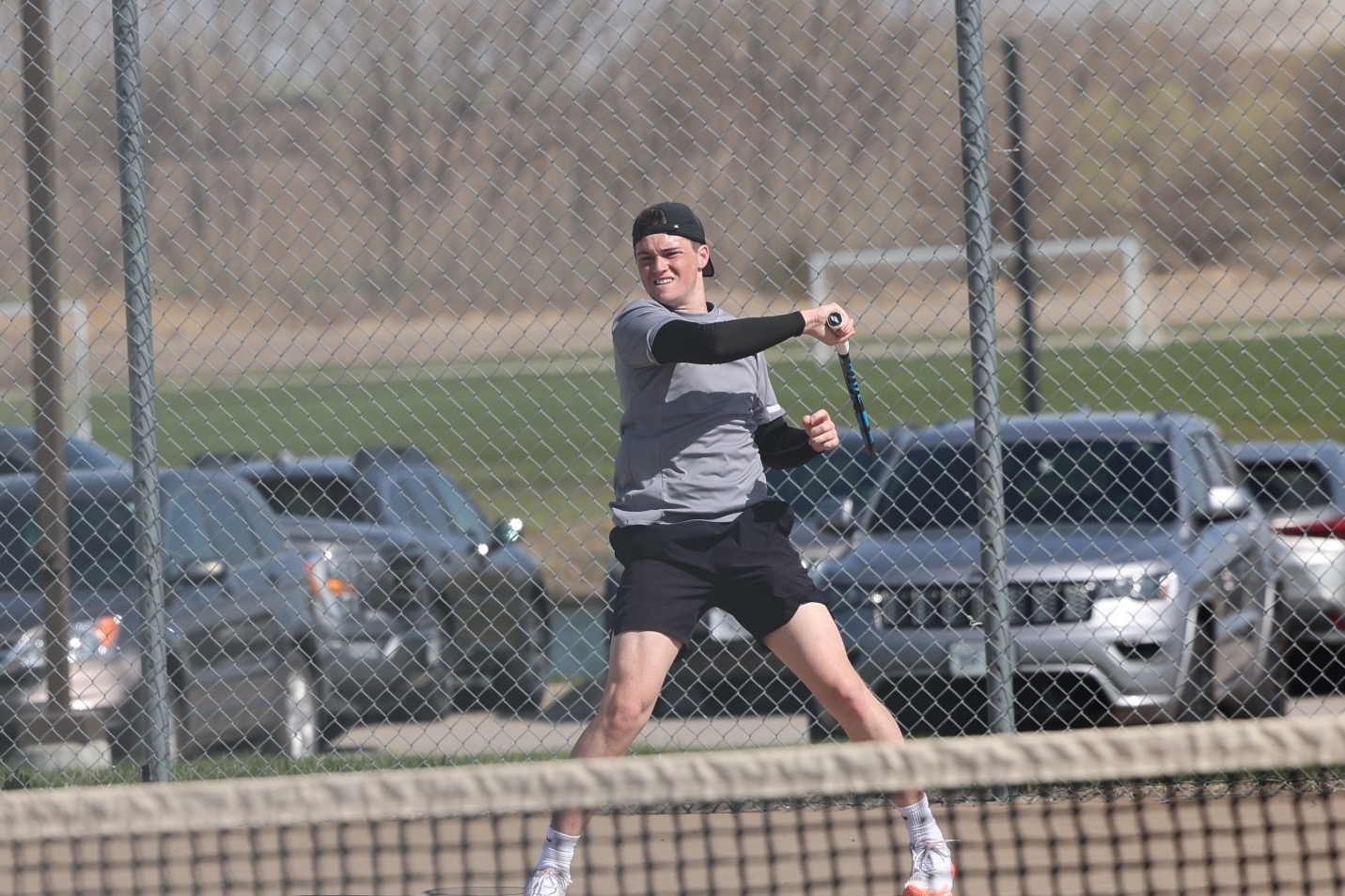 Jacob Balfany sends a return back over the net.
