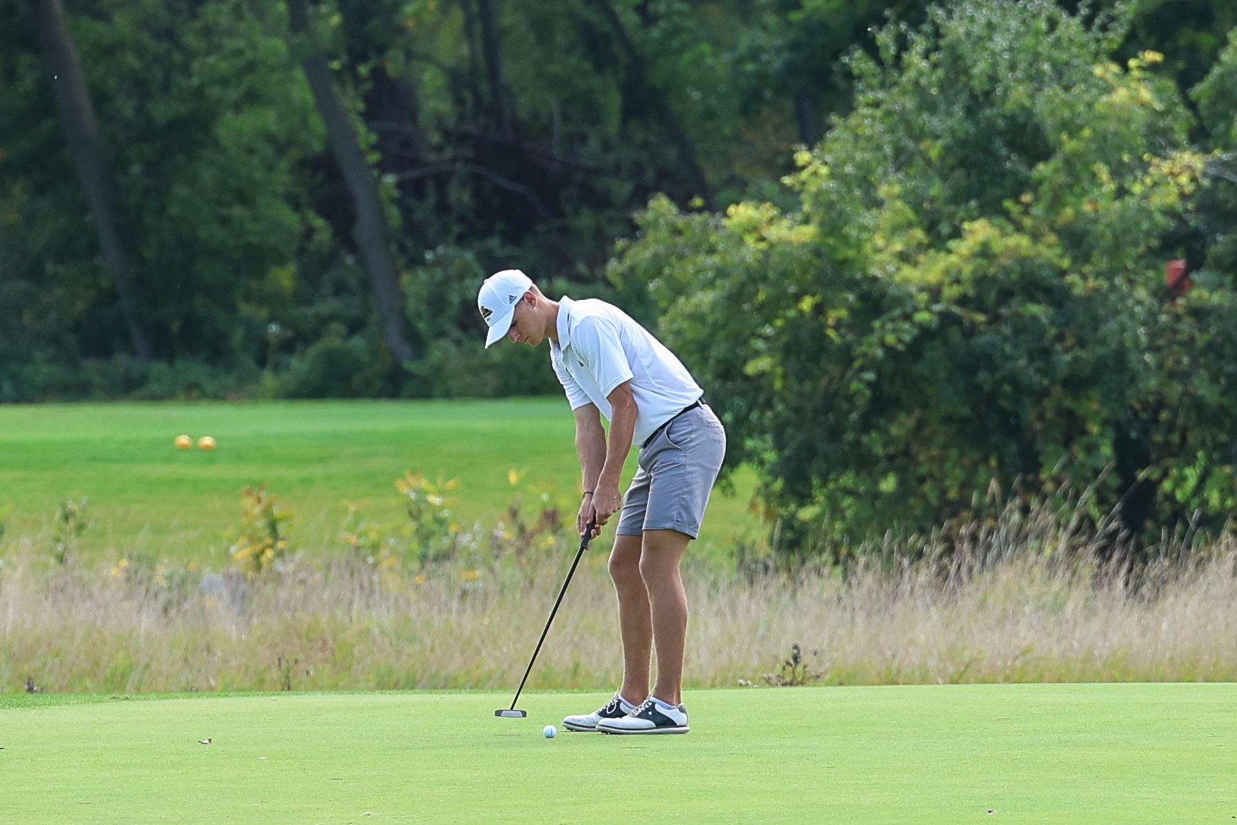 Brayden Schram hits a putt at the Midwest Region Classic
