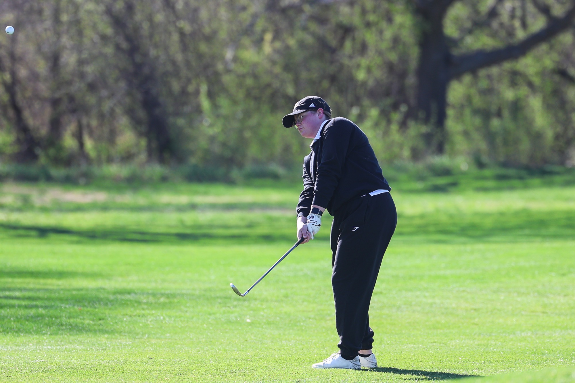 O'Brasia Amos chips onto the green at Pioneers golf course