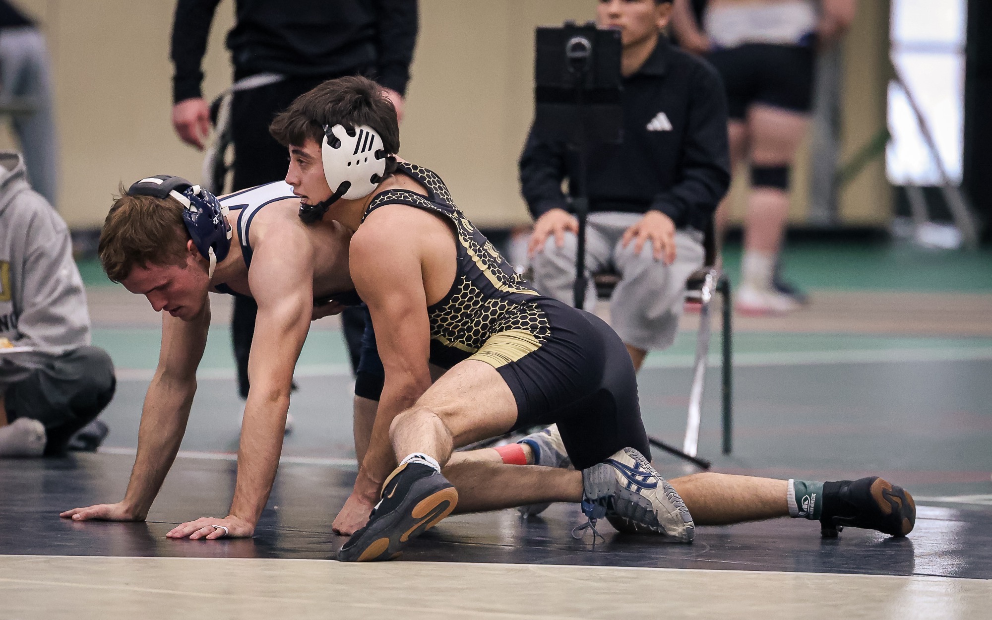 Quinton Chavez controls the top of a Westminster wrestler