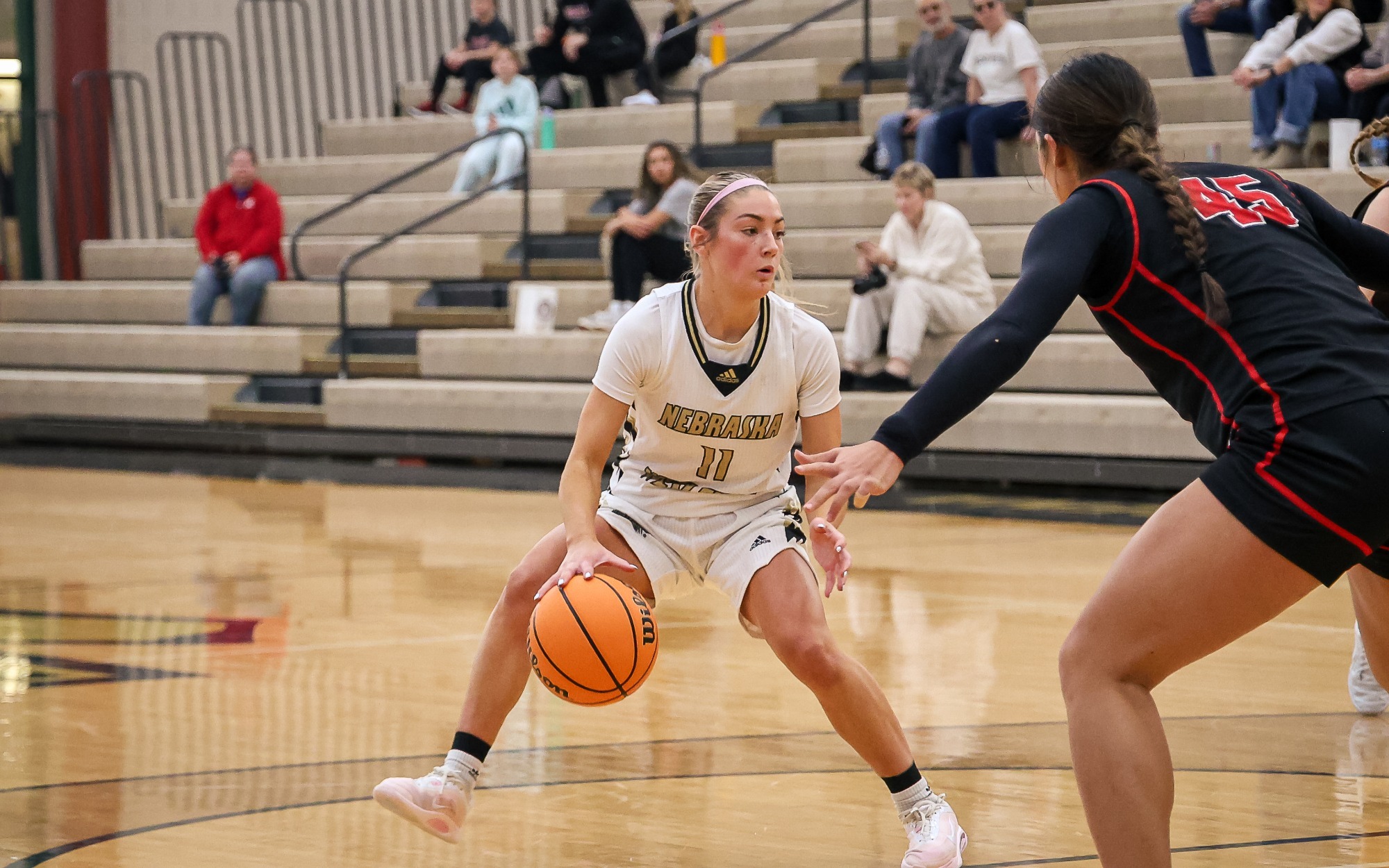 Anastyn Pettlon drives the lane against Grinnell