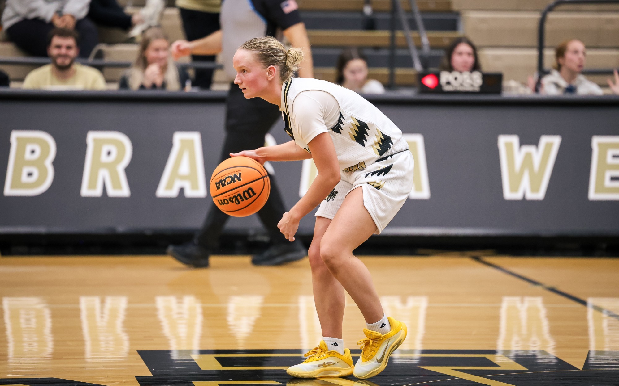 Peyton Tritz dribbles near half court