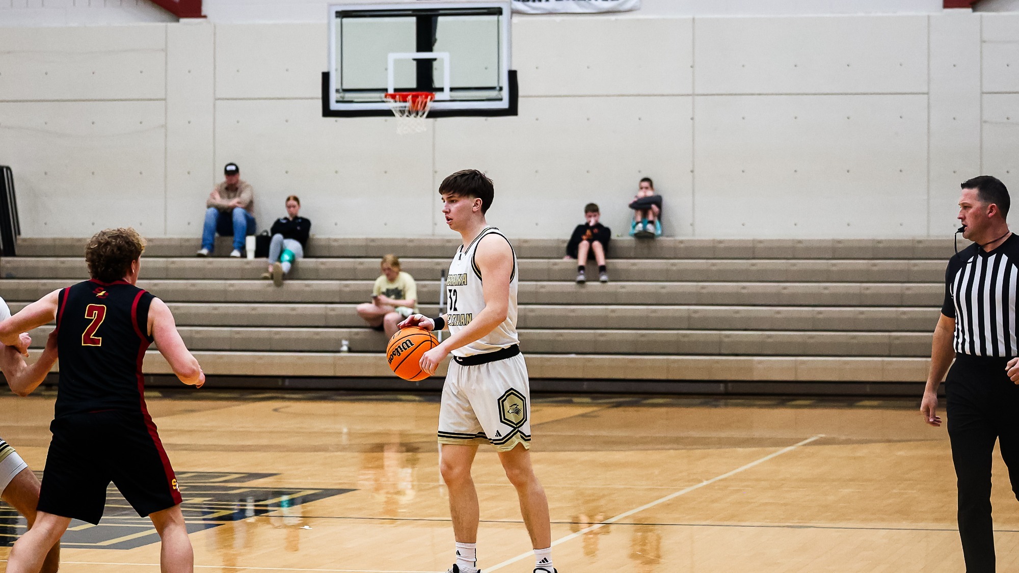 Basketball point guard sets up the offense