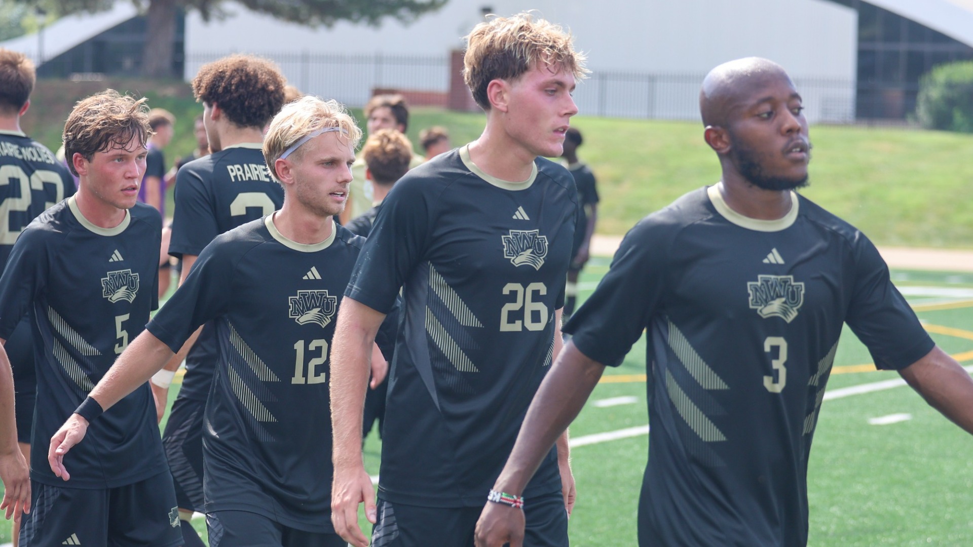 Men's soccer players go through the Handshake Line