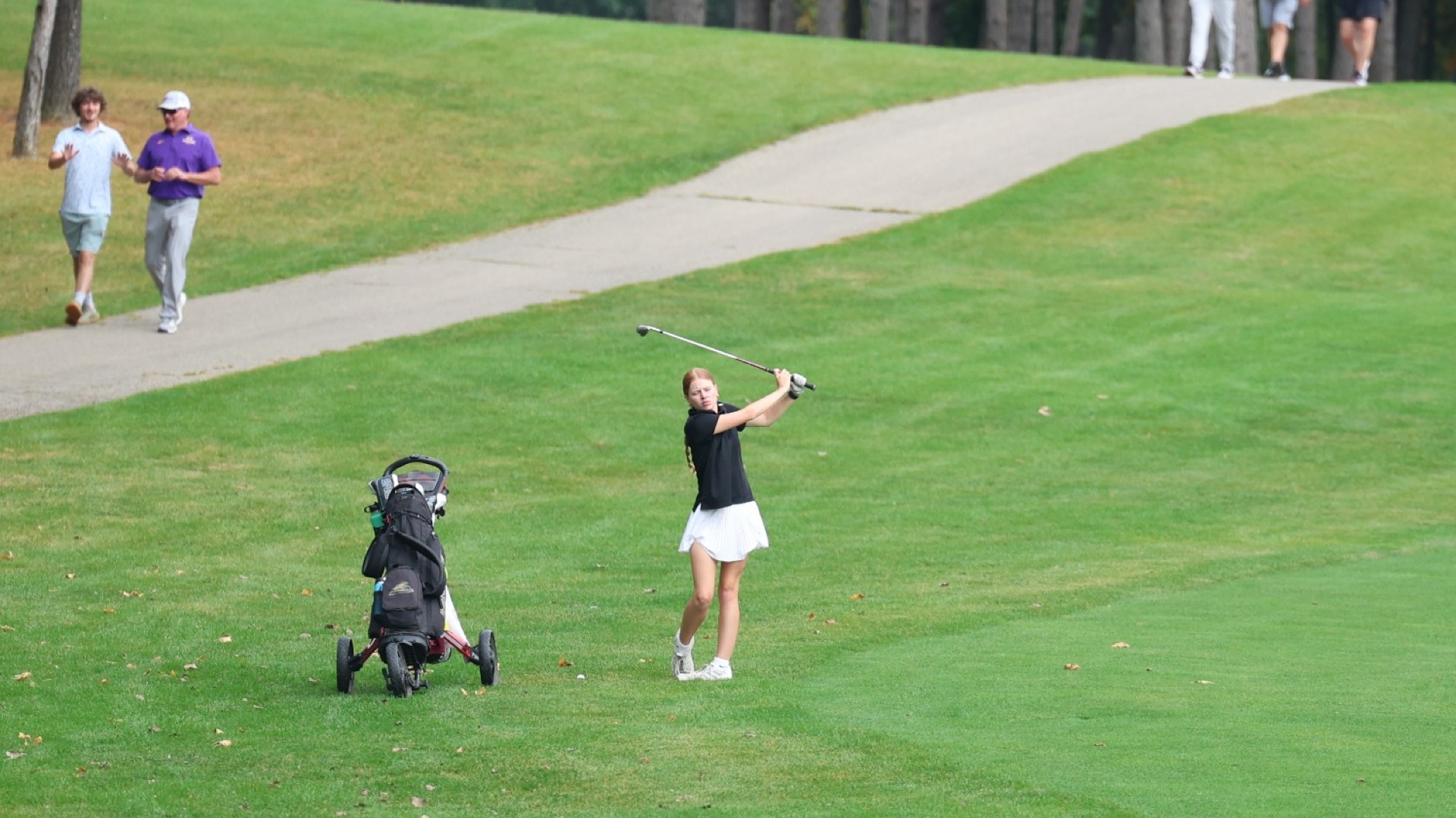 Lauren Hays drives a ball from the fairway onto the green