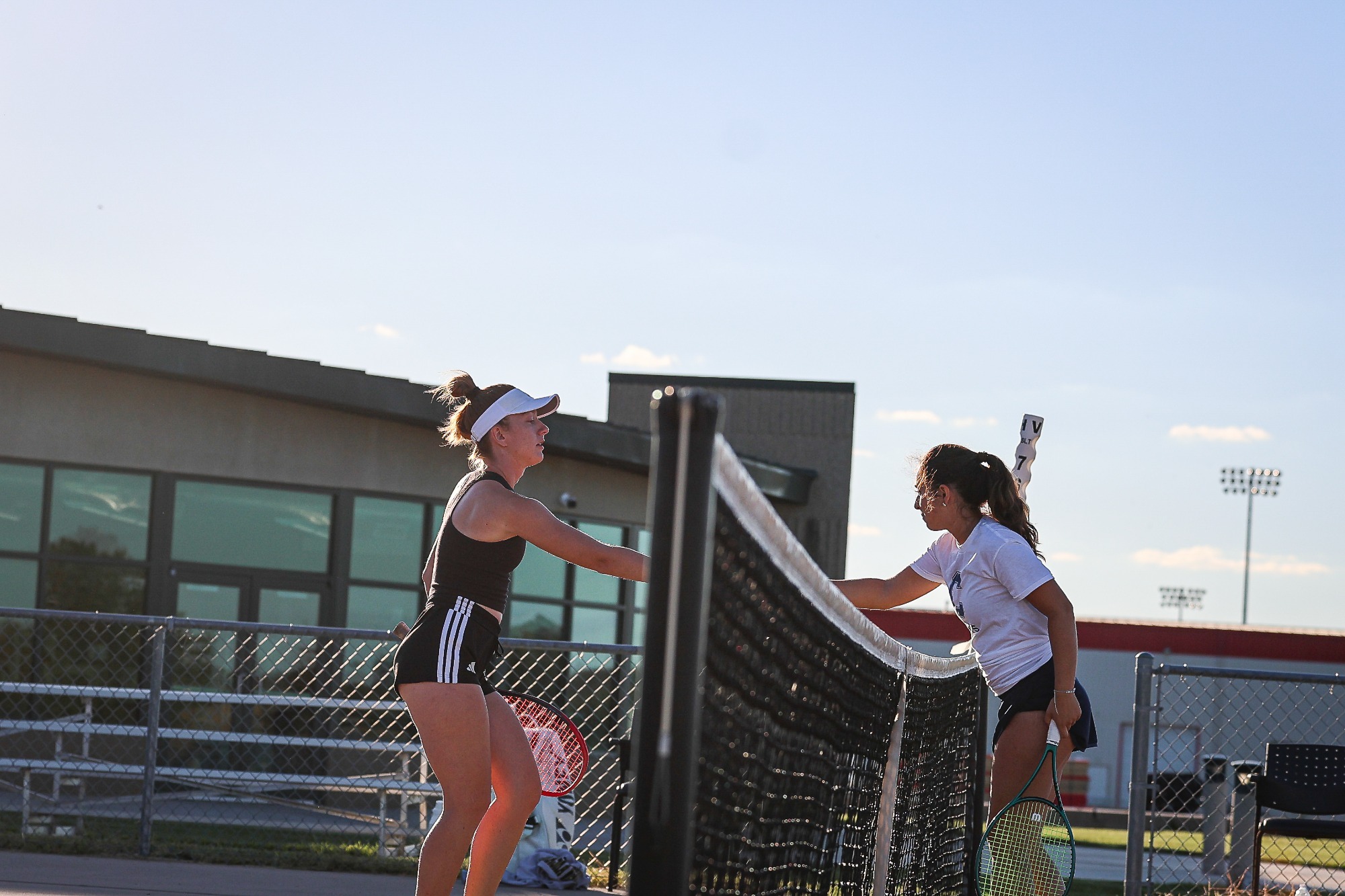 Sylvia Kamradt shakes hands with the opponent at the net