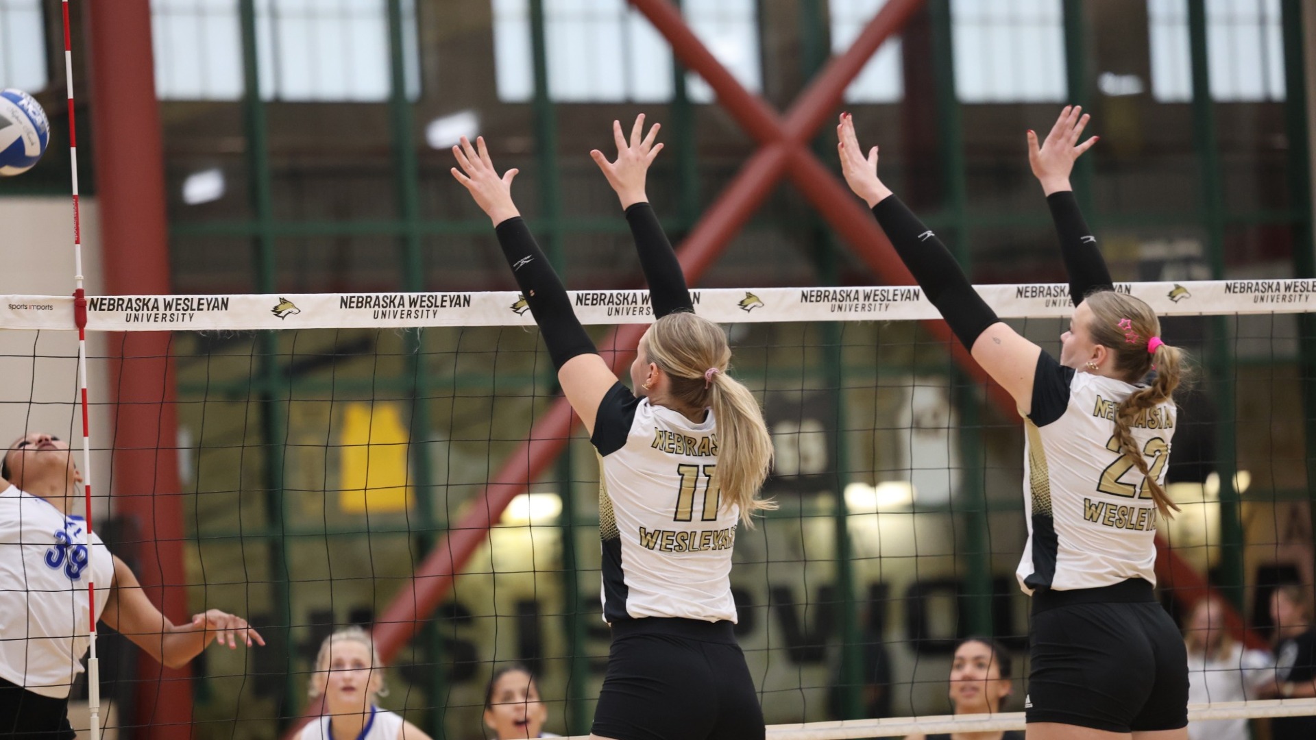 Macy Plucker and Mikyna Stoppkotte rise up for a block against York