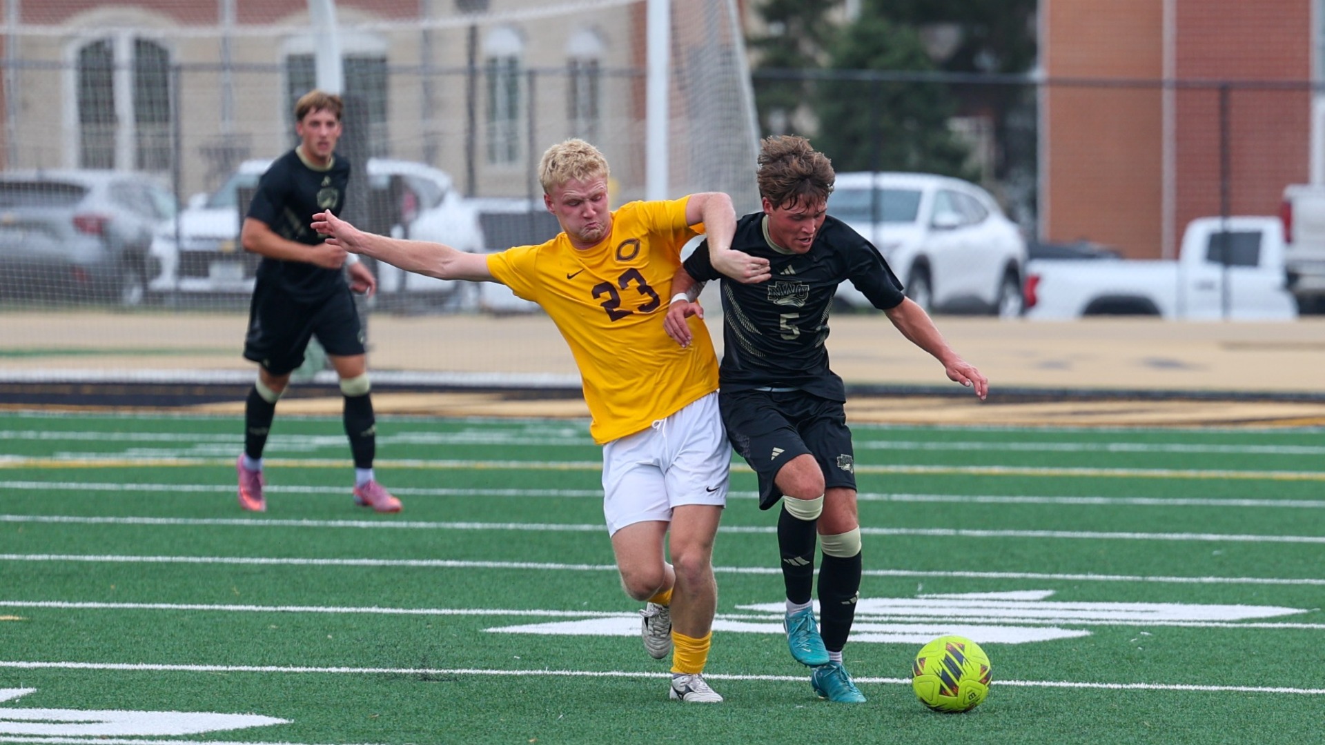 Thomas Pisasale fights with a defender for the ball.