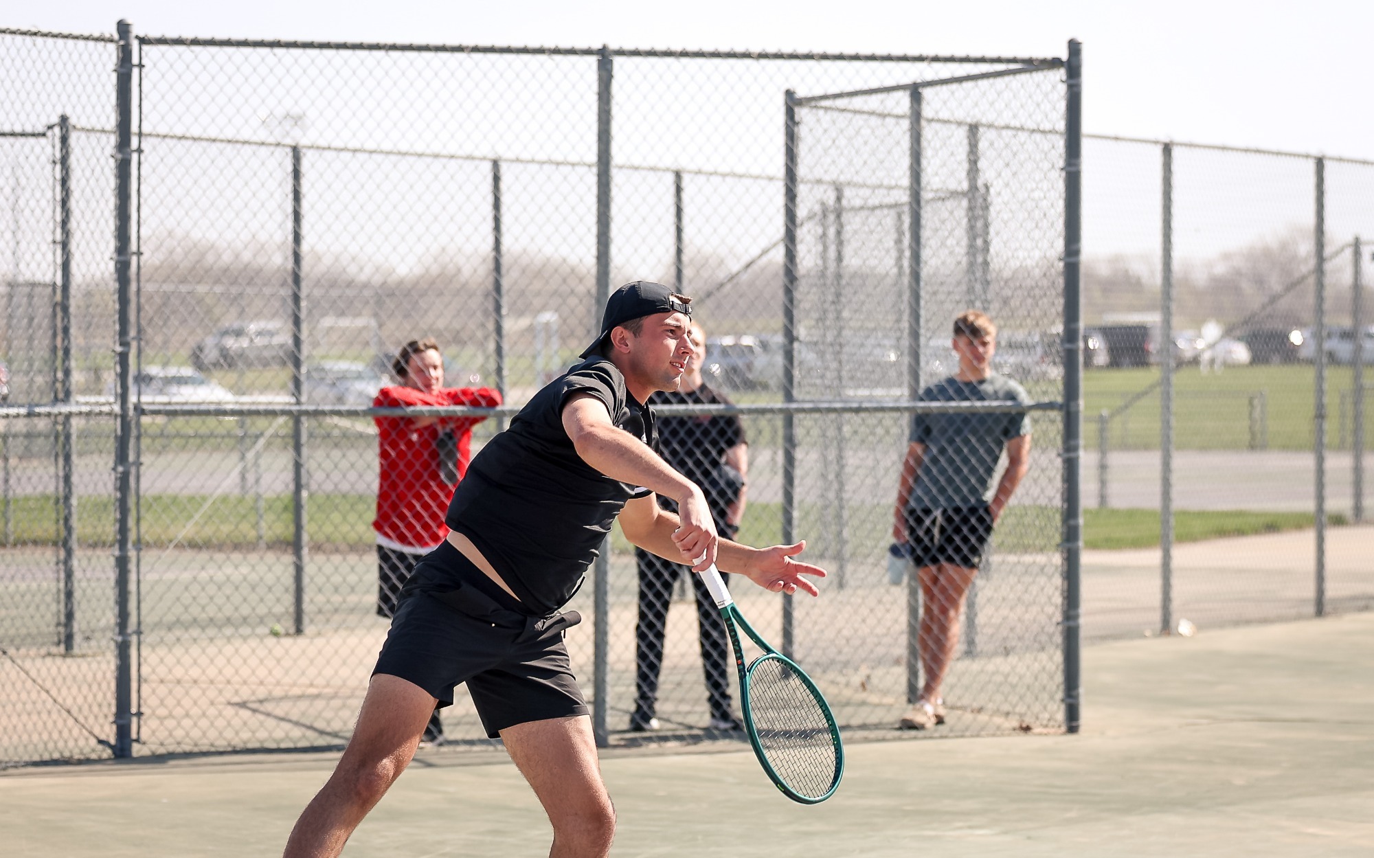 Ian Armbrust serves the ball