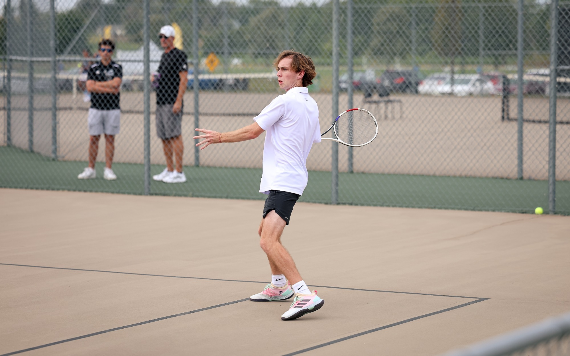 Sam Rademacher gets ready to send the ball back over
