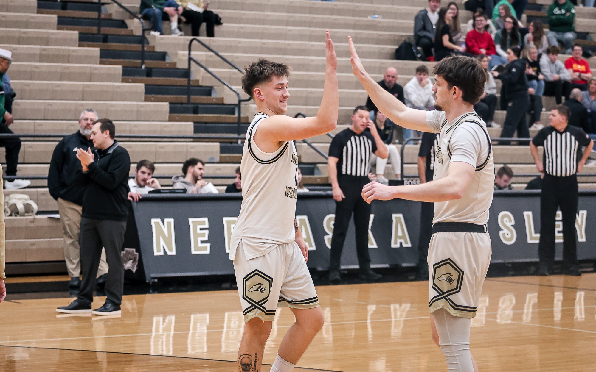 Jared Townsley high fives Seth Newton