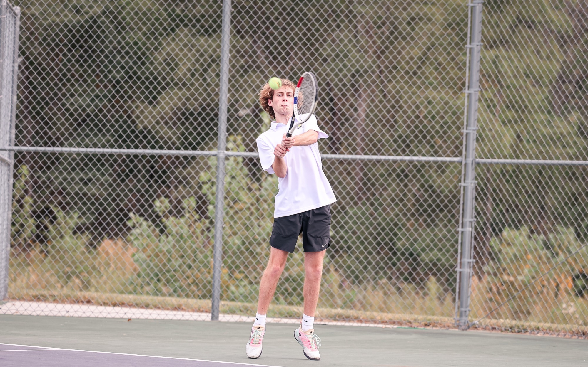 Sam Rademacher returns a powerful backhand