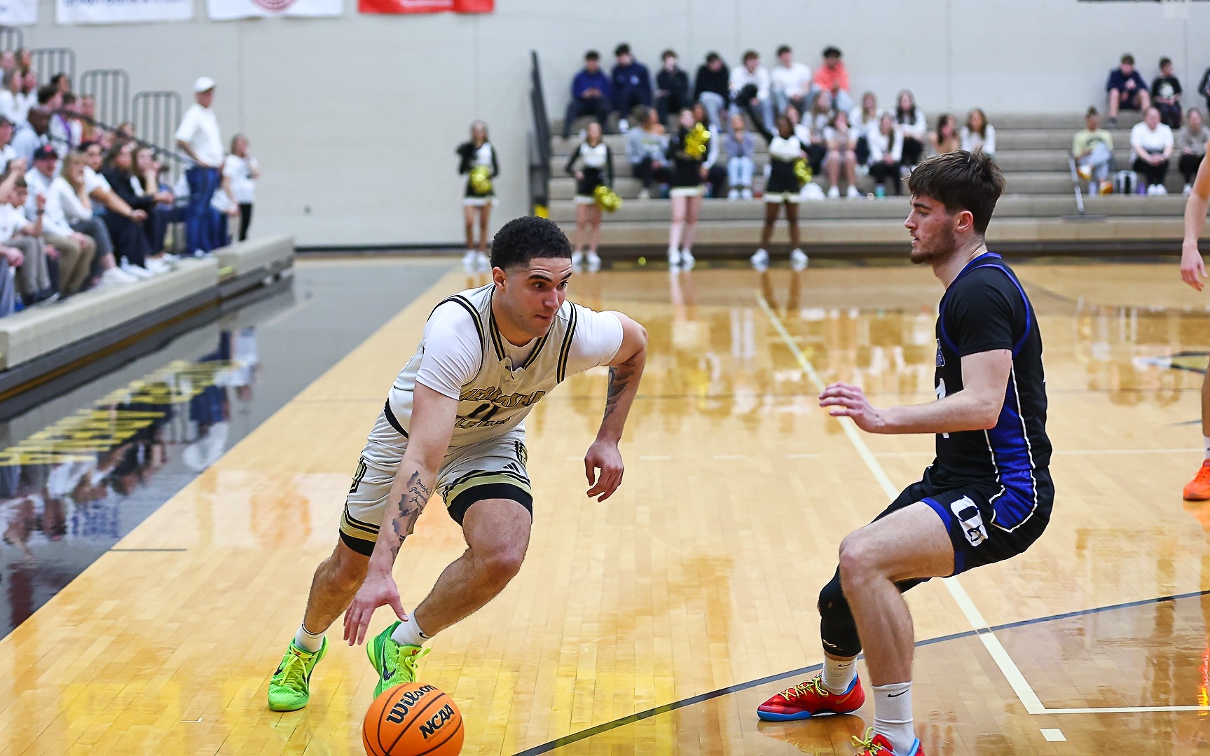 Amun-Ra Collins drives the baseline against dubuque