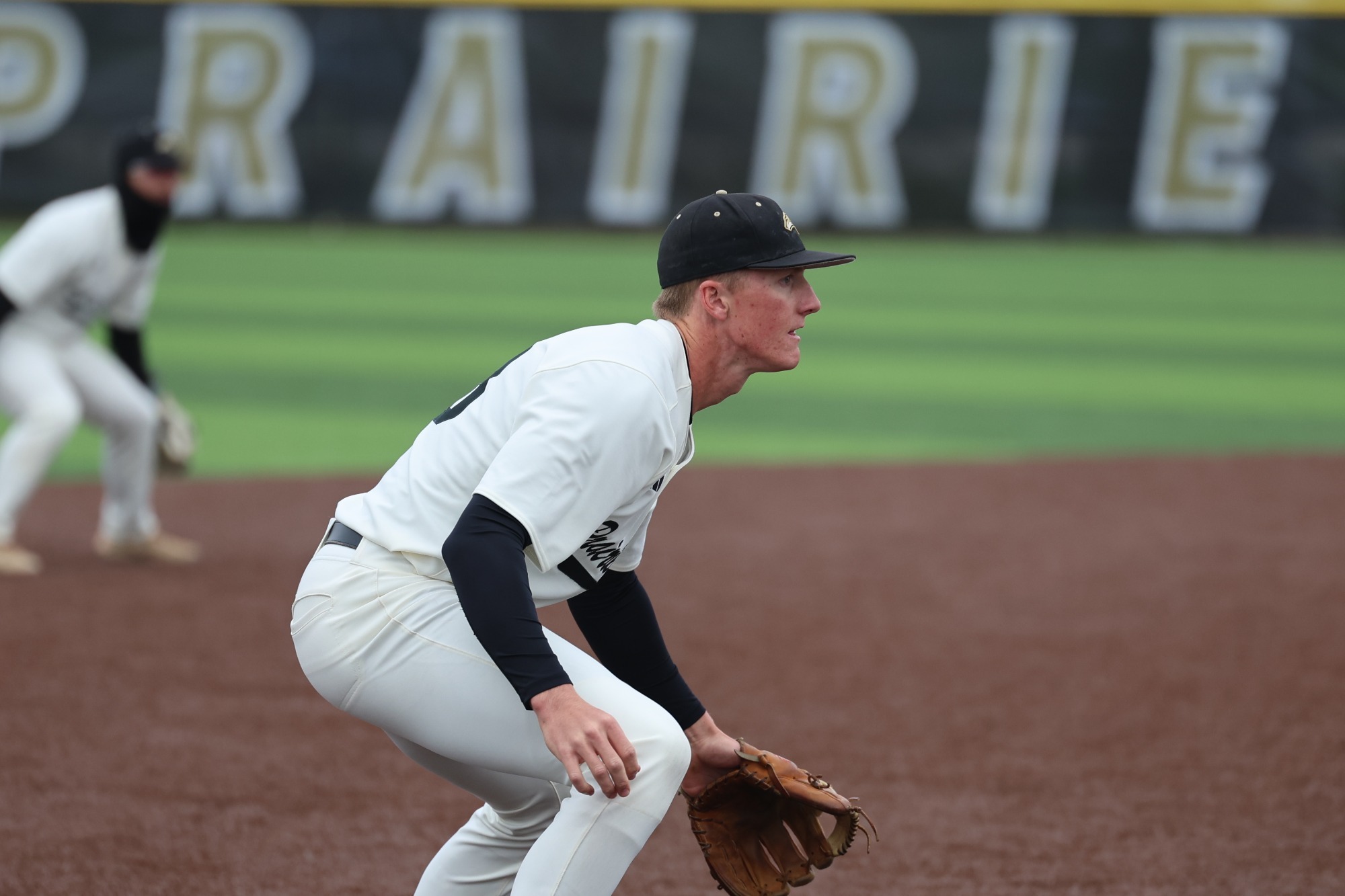 Easton Johnson fields a ball against Wartburg