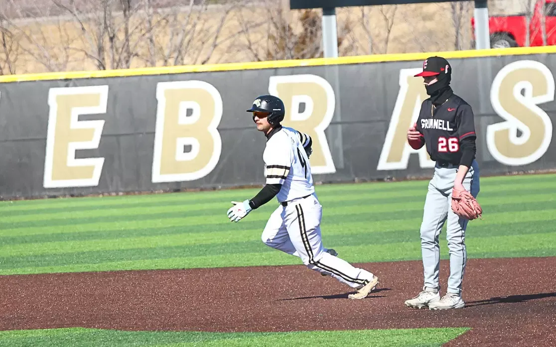 Duncan Ortega rounds second base after a double against Grinnell